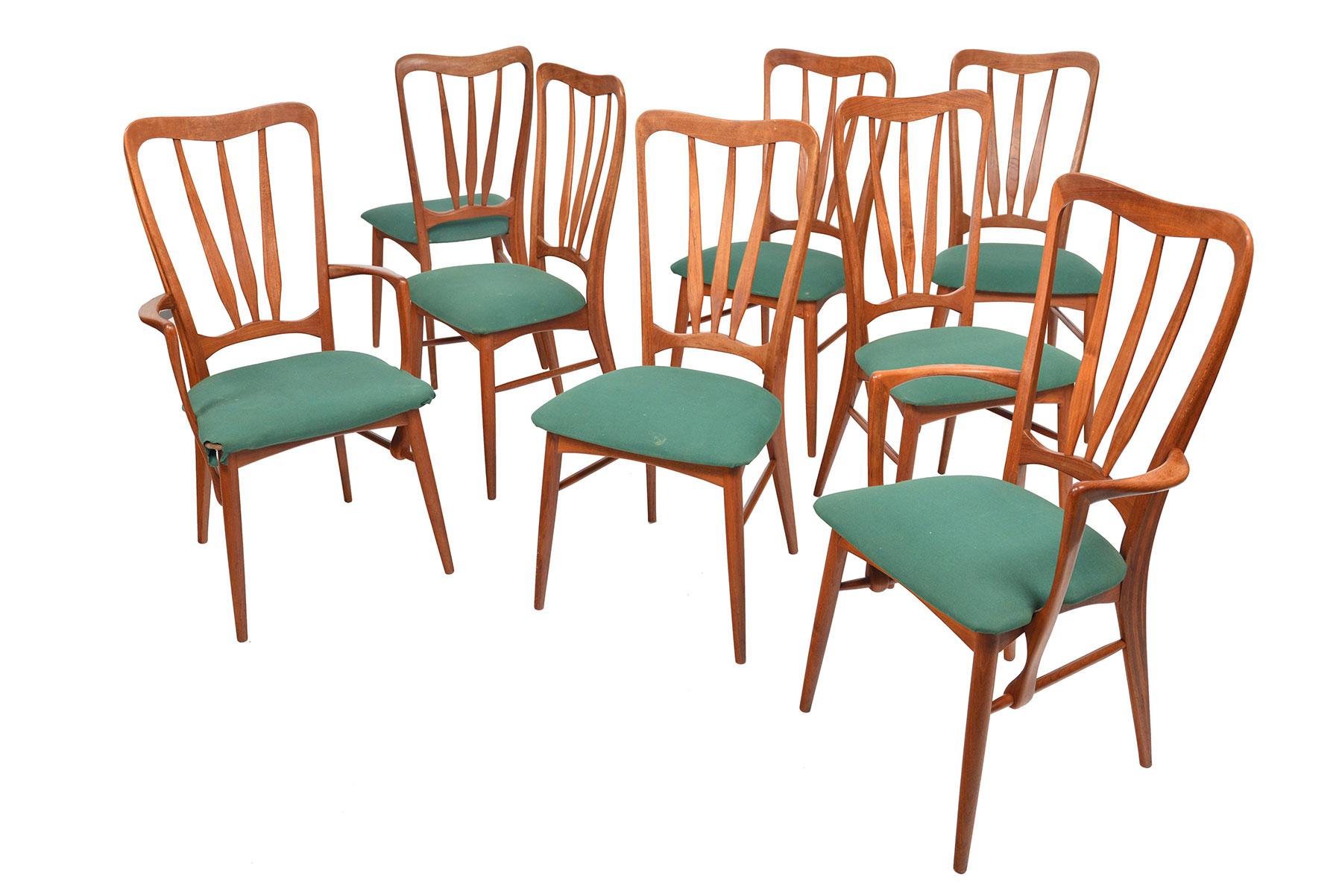 Set of eight teak dining chairs by Niels Koefoed for Koefoed Hornslet Møbelfabrik. Set includes two captain's chairs and six side chairs. Purchase price includes restoration.