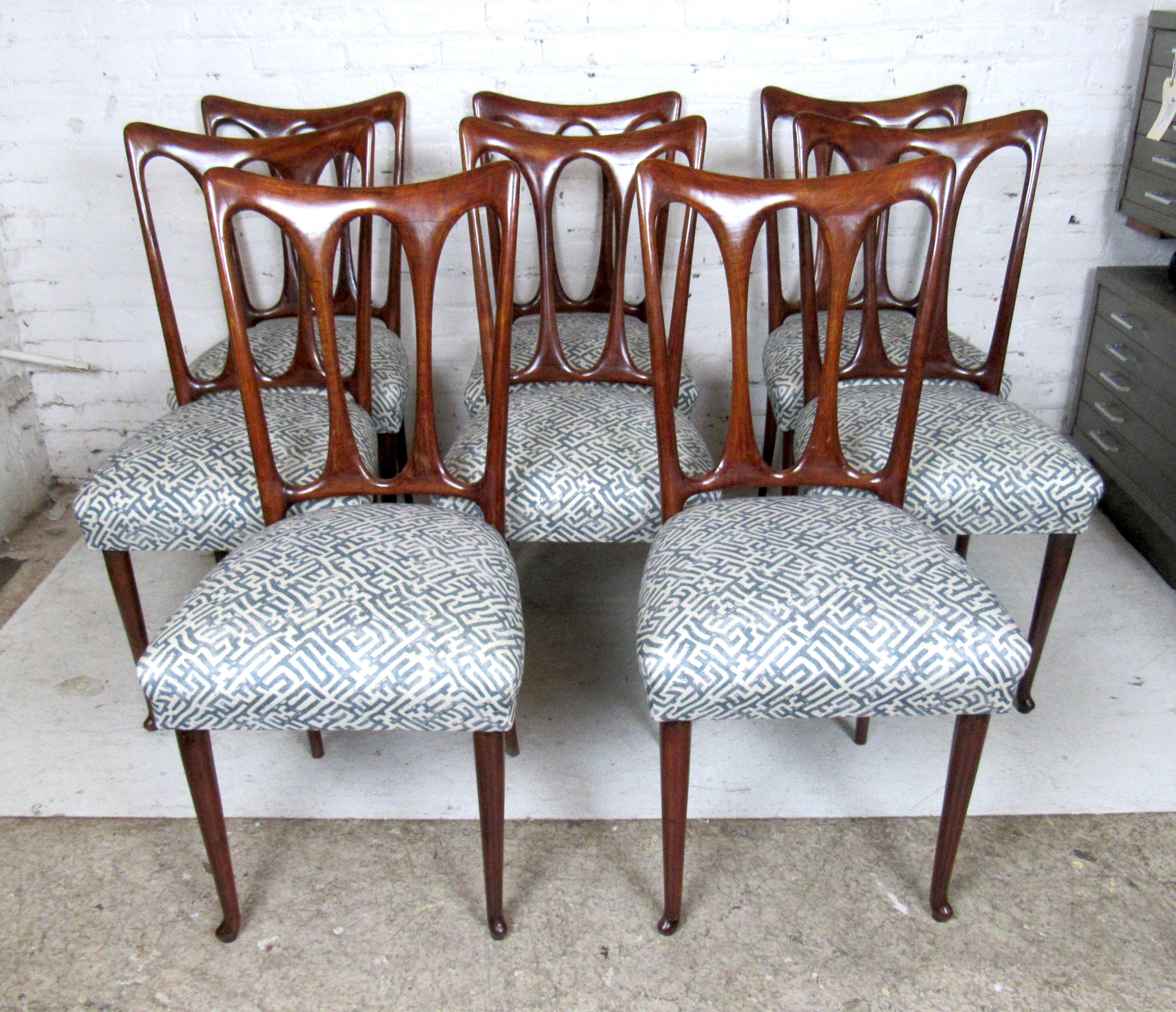 Mid-Century Modern set of eight Italian dining chairs with sleek upholstered seats.

Please confirm the item location (NY or NJ).