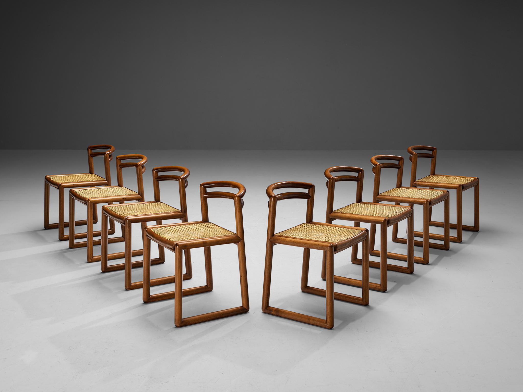 Set of eight dining chairs, dark lacquered beech, cane, Italy, 1970s. 

Set of eight quirky Italian dining chairs. These chairs feature a lacquered wooden frame with a modest gloss finish that brings out the grain pattern in an elegant manner. The