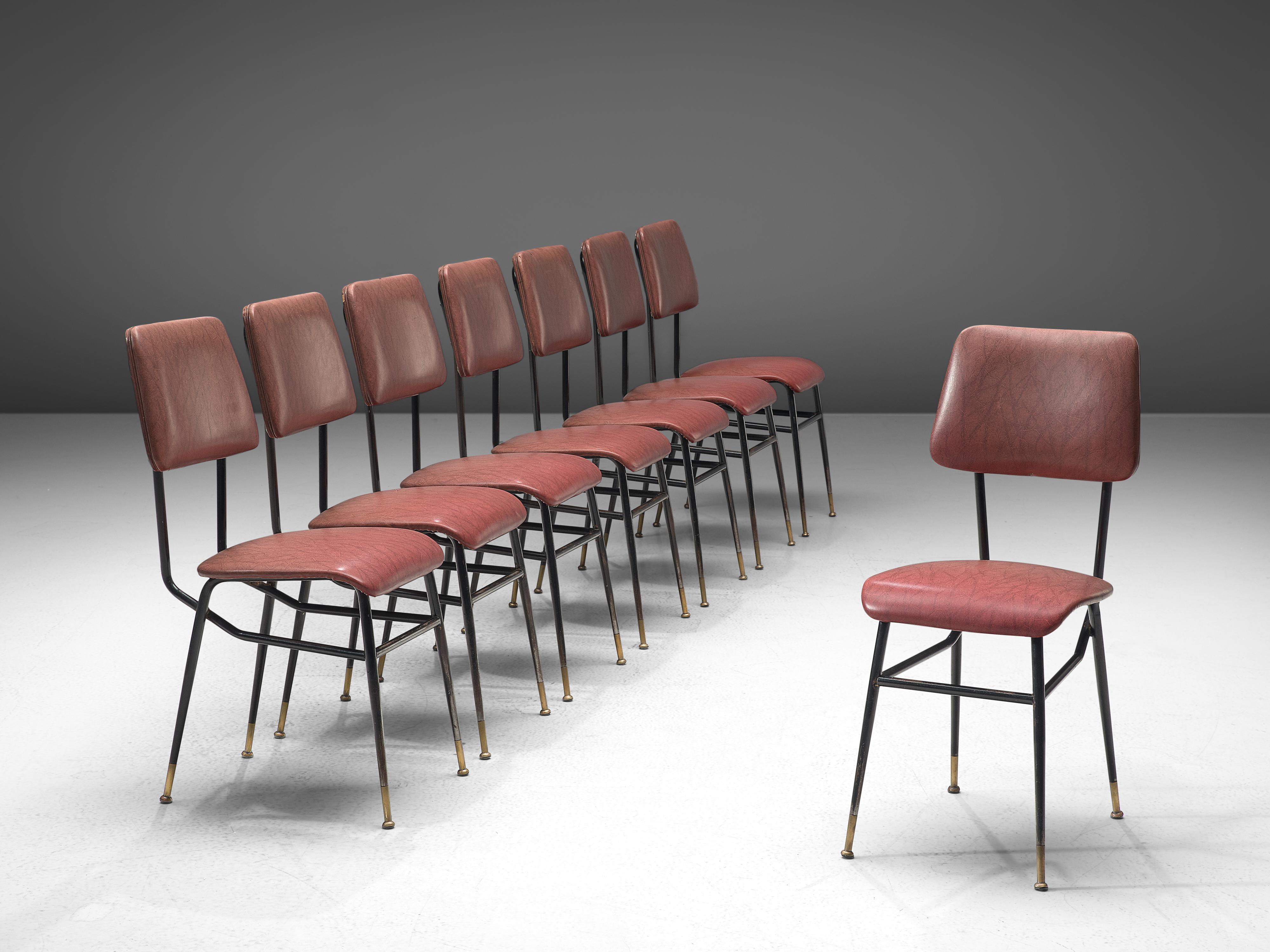 Studio architects BBPR (attributed), set of eight chairs, pink to red faux leather, metal, brass, Italy, 1950s

This set of eight chairs with varnished metal rod structure have strong features of Studio BBPR's designs, and therefore is attributed to