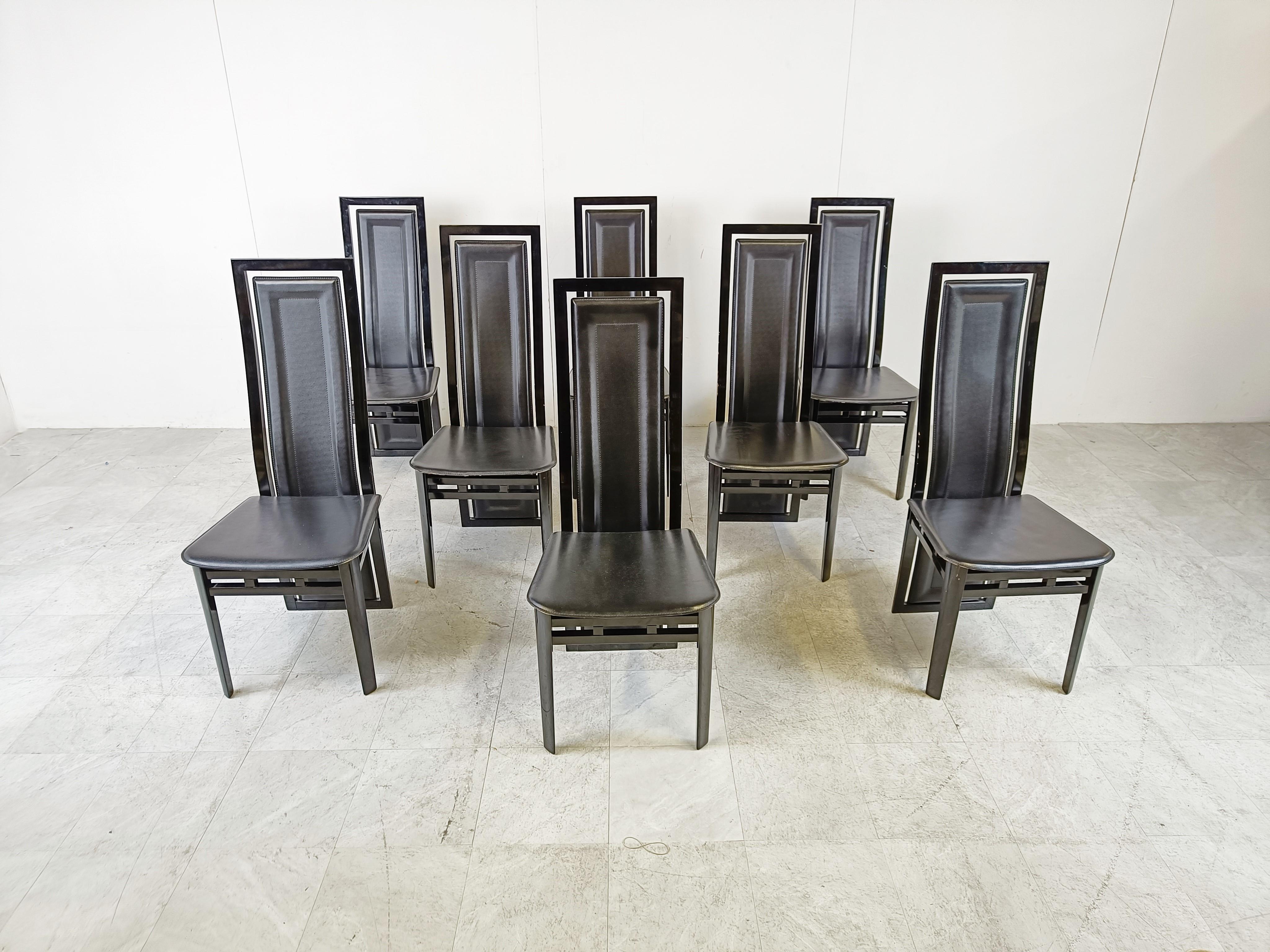 Set of 8 highback dining chairs with black lacquered wooden frames and leather seats and backrests.

The back curves down and becomes the back leg. 

Beautiful design by Antonio Sibau.

Timeless chairs with a nice luxury appeal.

Good