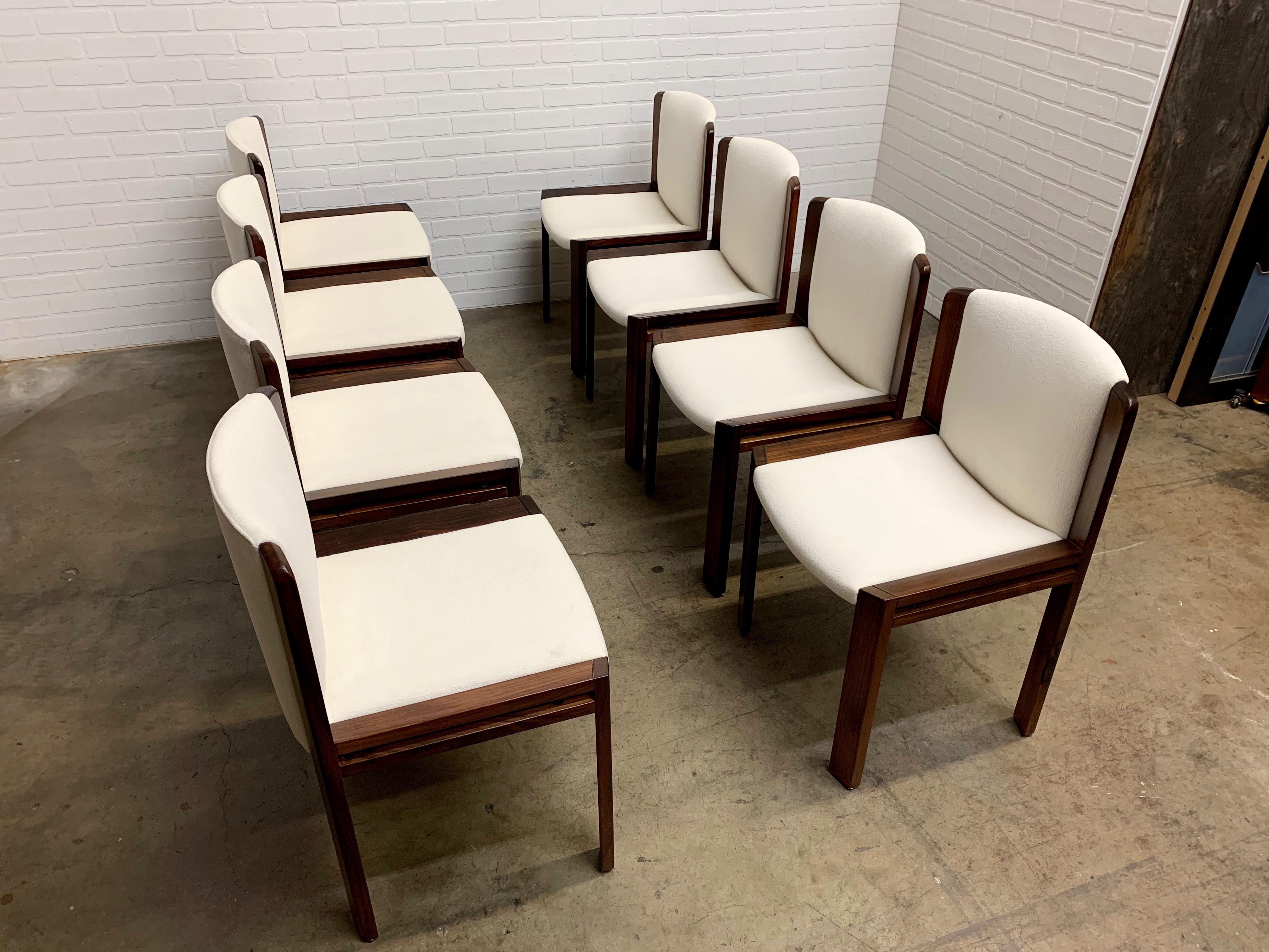 Italian design by Joe Colombo 1960s lightly refinished rosewood with new upholstery very rare to have a set of eight.