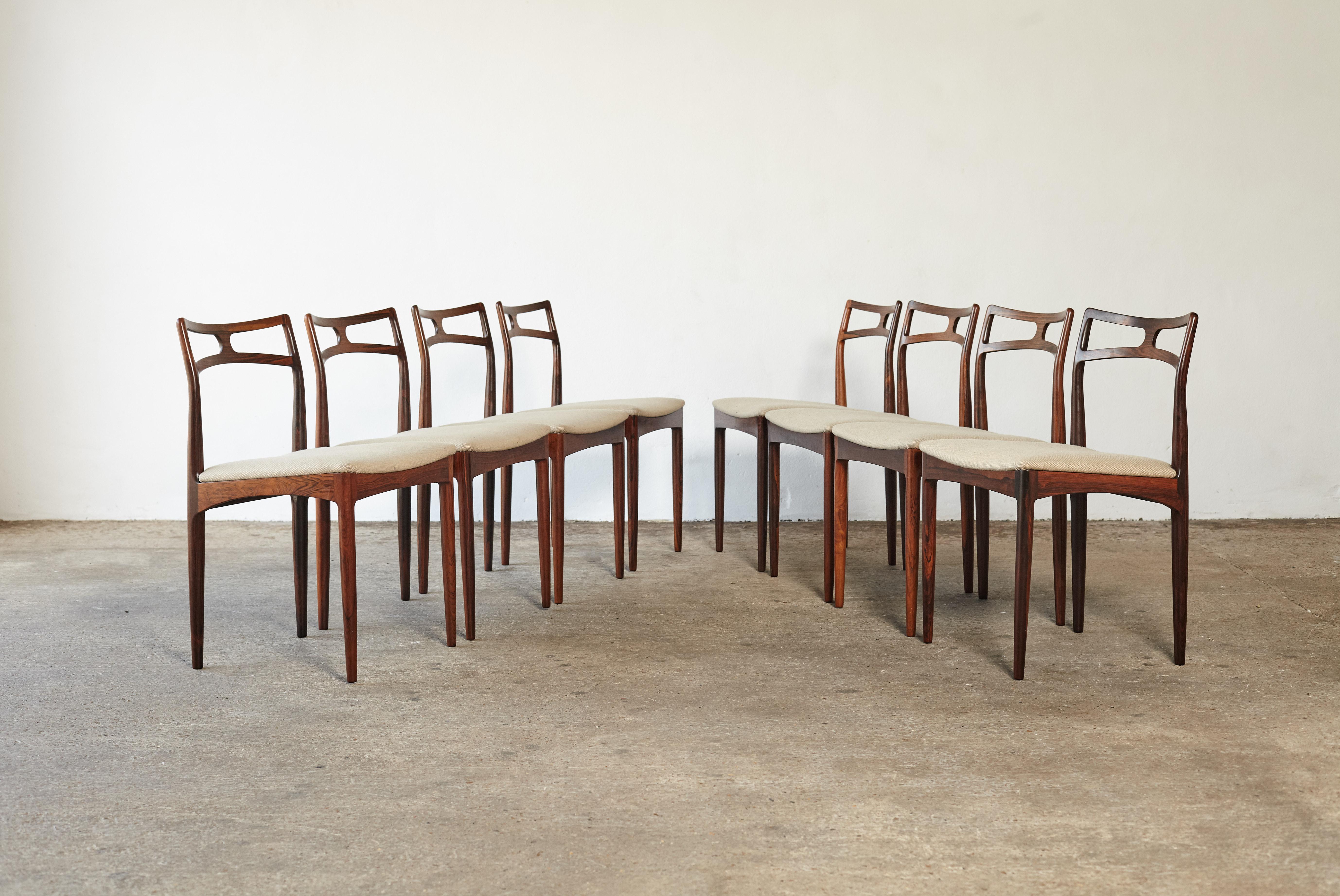 A set of eight Johannes Andersen model 94 rosewood dining chairs, produced by Christian Linneberg, Denmark, 1960s. Original fabric seat covers. Very good vintage condition.
