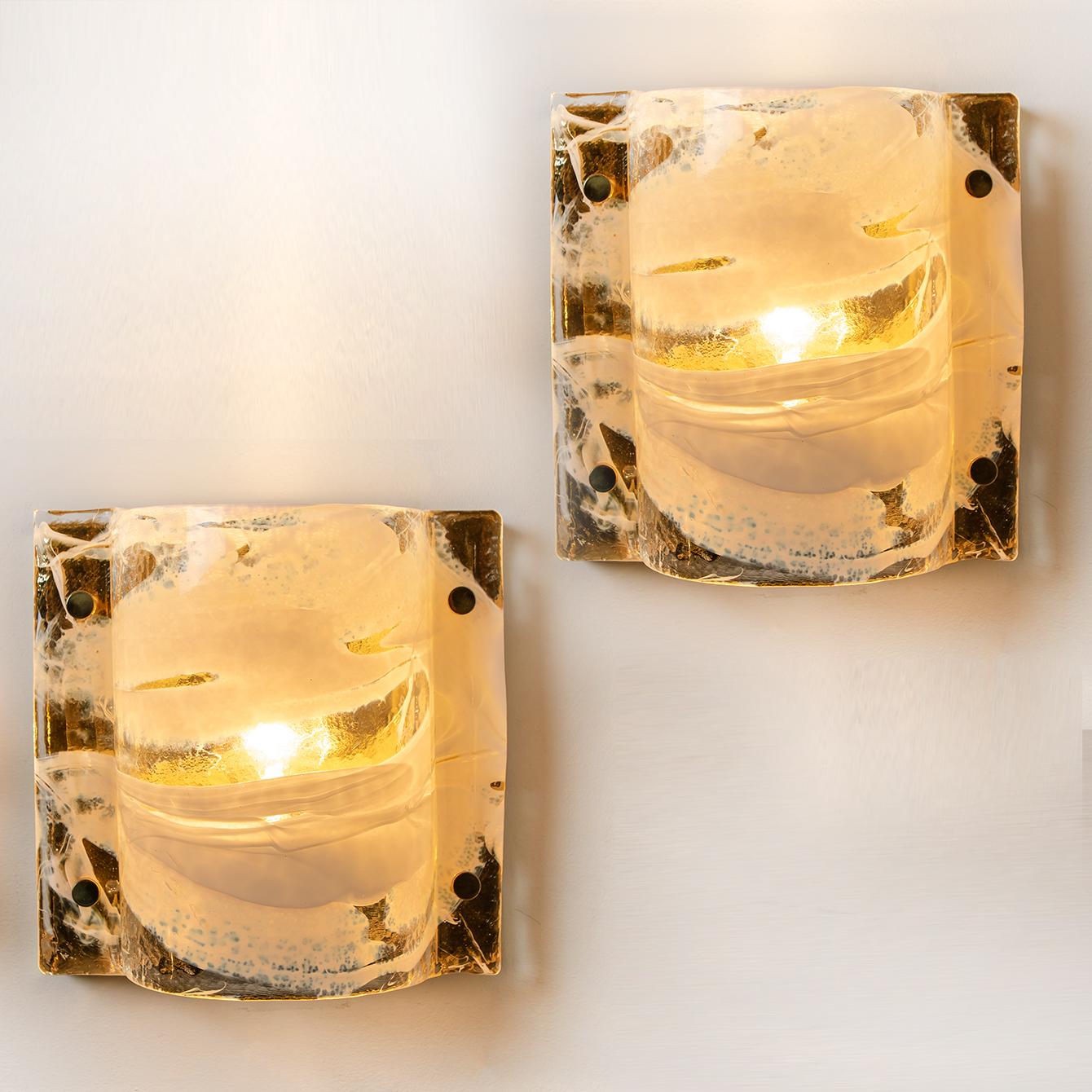 Very elegant set of J.T. Kalmar sconces featuring thick white and clear swirl glass on a gilded brass base. Minimalistic design executed with a taste for excellence in craftsmanship. Illuminates beautifully.

The two large flushmounts (can also