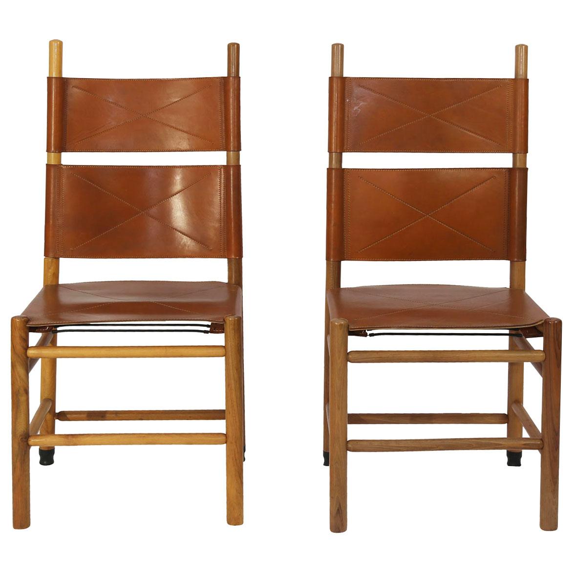 Set of eight “Kentucky” chairs designed by the Master of Design; Carlo Scarpa for Bernini in 1977. Made from oak and walnut timber the chairs retain the original luggage color leather seat and backrest with saddle stitching. Scarpa was inspired by