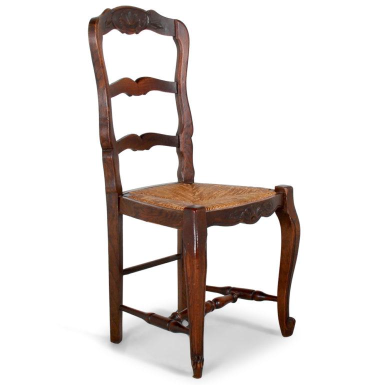 A set of eight French oak ladder-back, rush-seat chairs with nicely-carved backs and front rails. Two armchairs and six side chairs, circa 1930.

Side chairs: 19? wide x 19? deep x 39? tall x 18? floor-to-seat.
Armchairs: 23? wide x 20? deep x