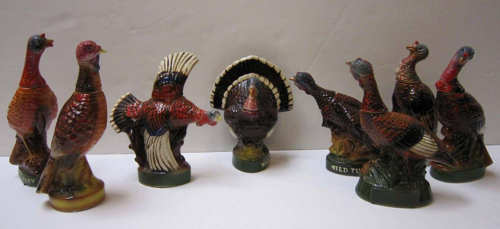 A set of eight large vintage wild Turkey decanters featuring the hard-to-find #one and #two decanters and the popular #three flying and #eight fan-tail decanters.

Marked on base: Austin Nichols ceramic creation liquor bottle, Wild Turkey 101 proof,
