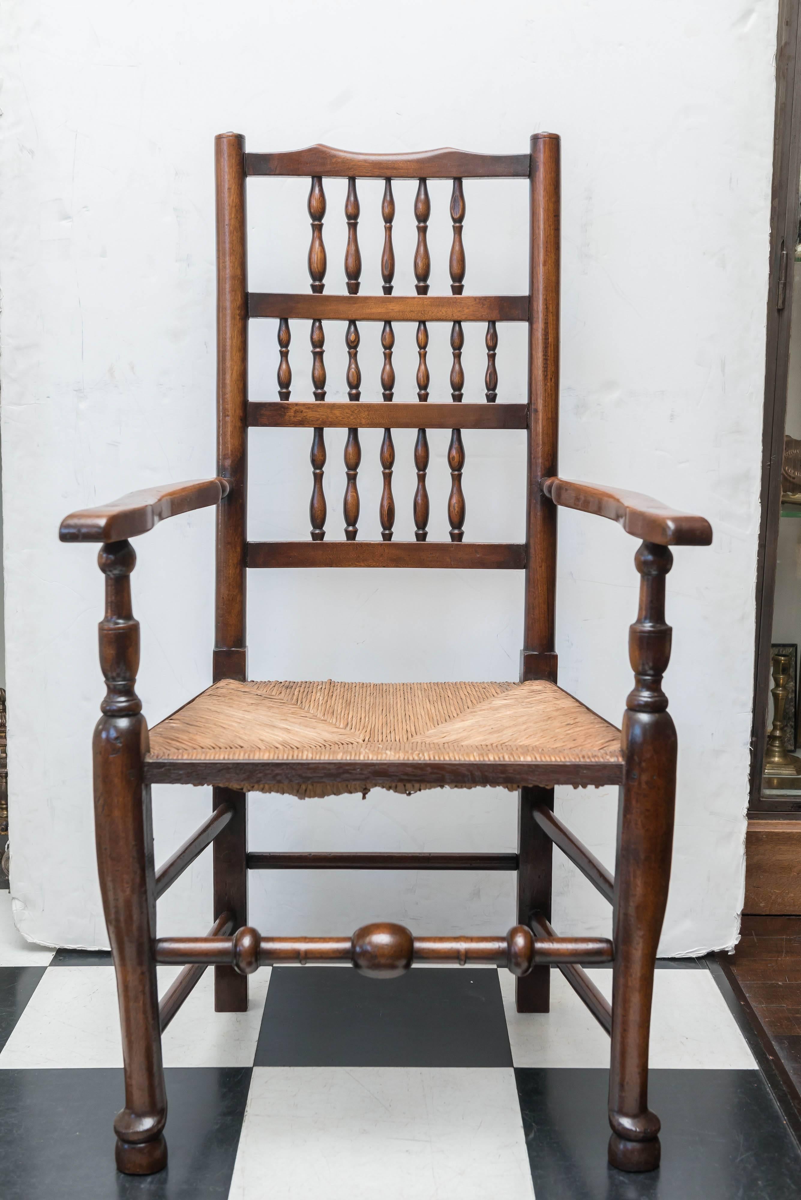 A set of eight late 18th-early 19th century English ladder back, rush seat, chairs, circa 1800. Two arm / master chairs and six side chairs.
Walnut and elm with rush seats. All all the old repairs and tipped feet very well done and solid. Never