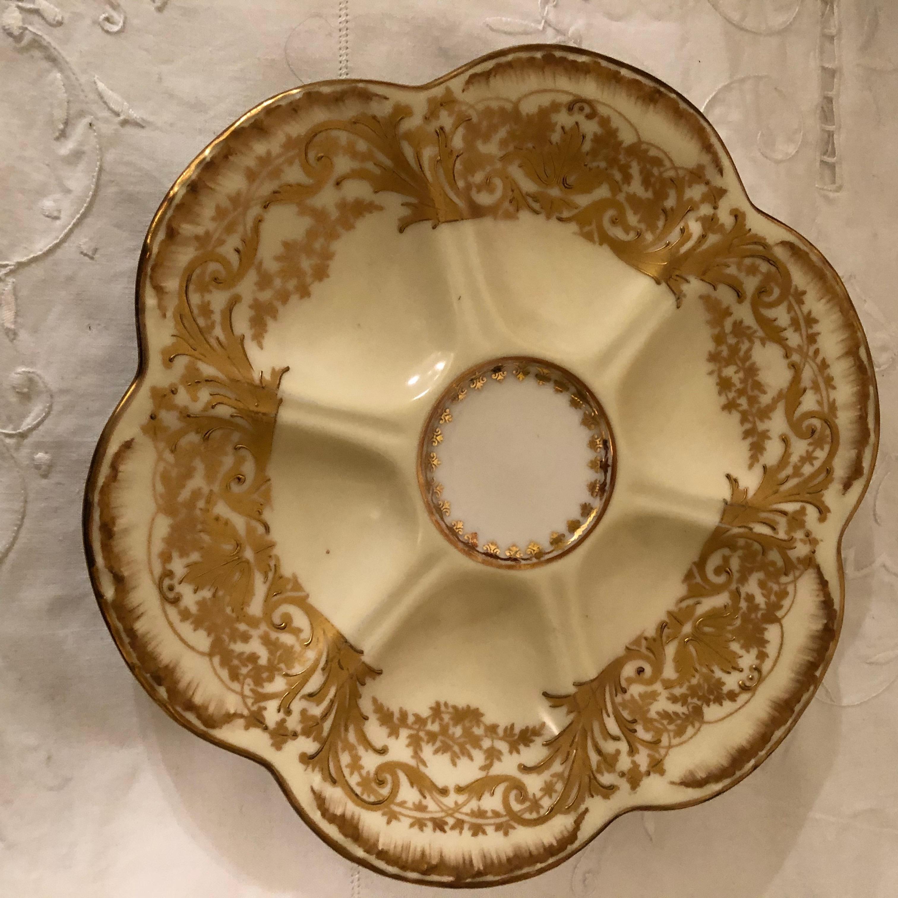 Rococo Set of Eight Limoges Oyster Plates with Profuse Raised Gold Decoration