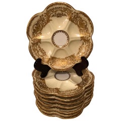 Set of Eight Limoges Oyster Plates with Profuse Raised Gold Decoration