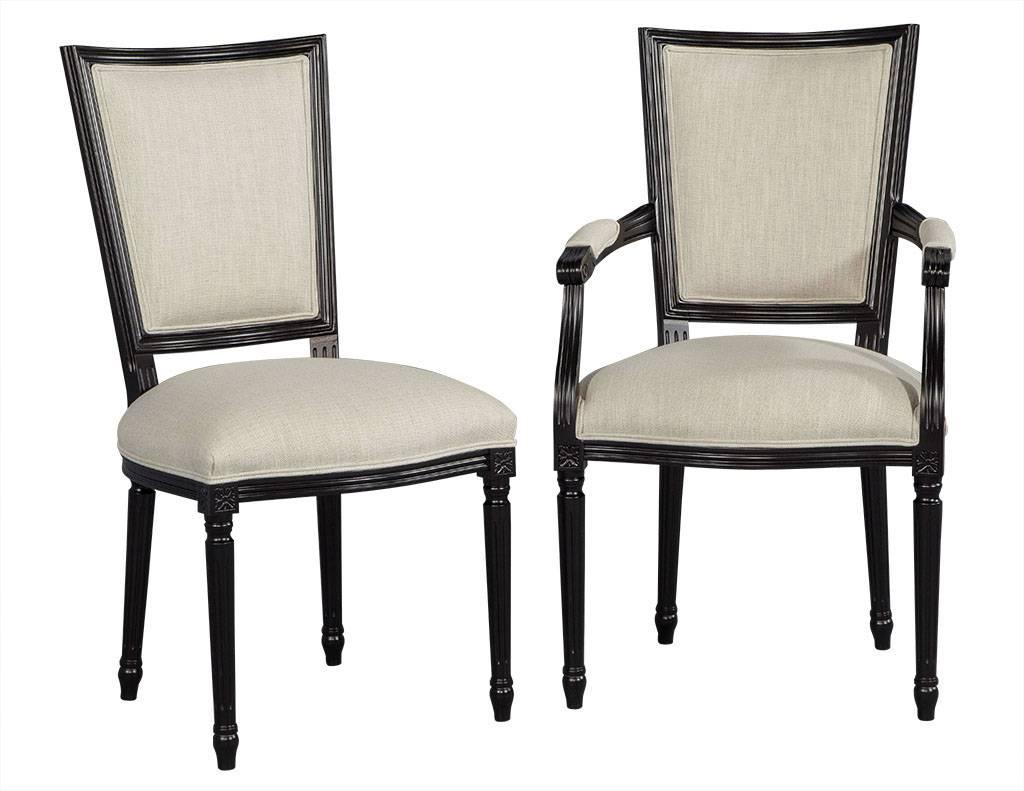 Set of eight Louis XVI style black lacquer dining chairs. This Louis XVI style dining chair set hails from Italy. Composed of beechwood frames hand-finished in a satin black lacquer and finished and reupholstered by our team in a Belgian linen,