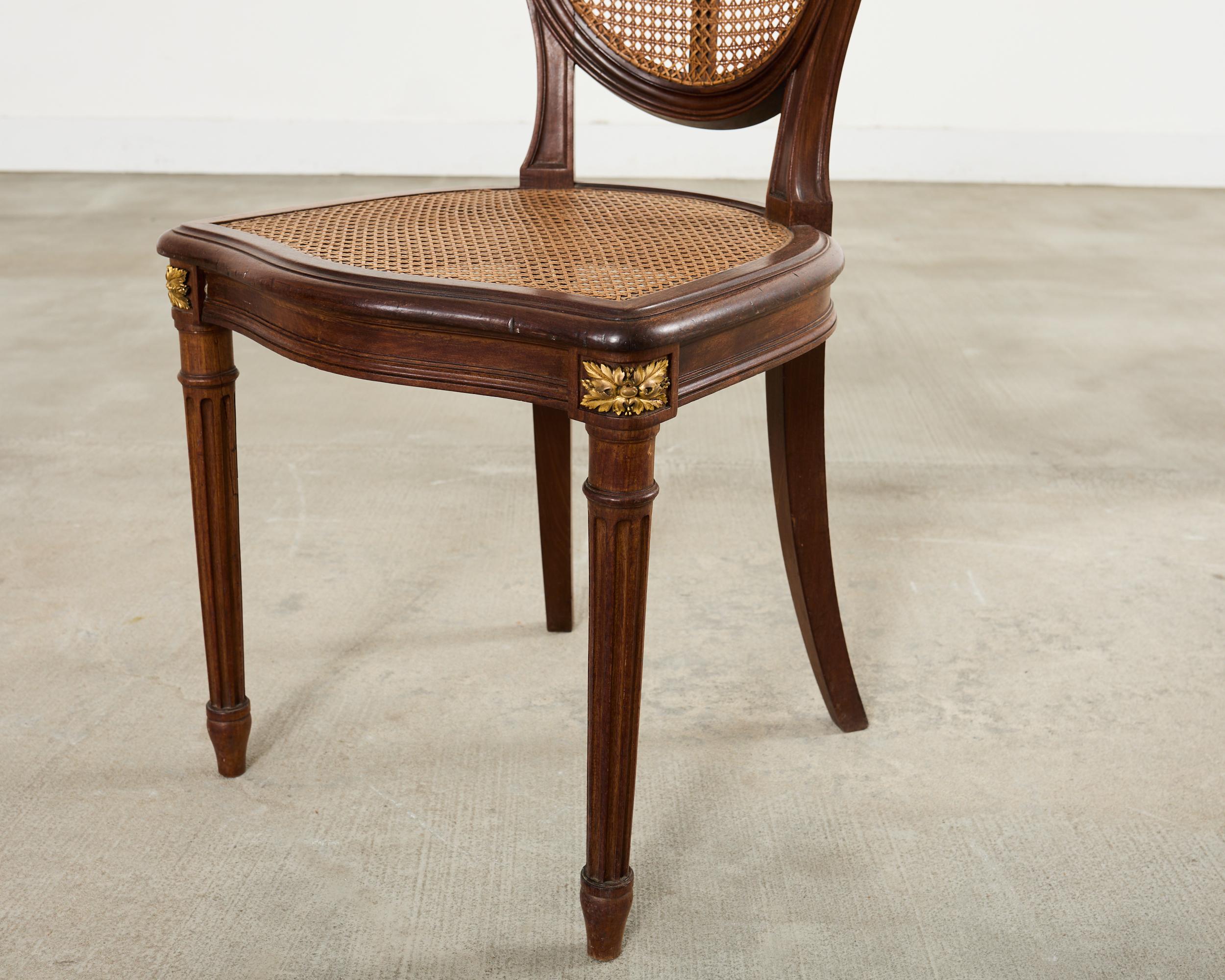 Set of Eight Louis XVI Style Bronze Ormolu Caned Dining Chairs en vente 9