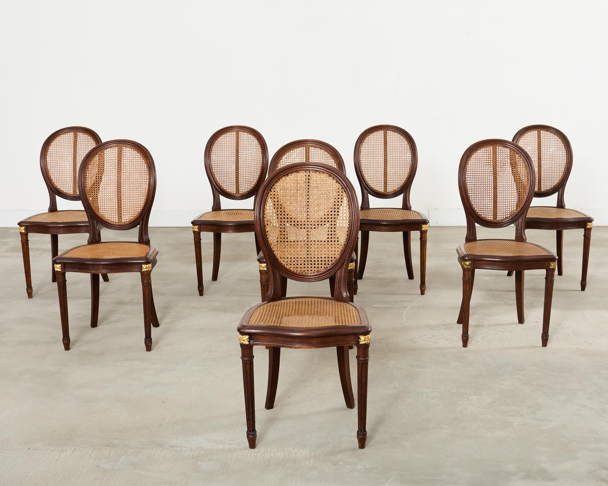 Français Set of Eight Louis XVI Style Bronze Ormolu Caned Dining Chairs en vente