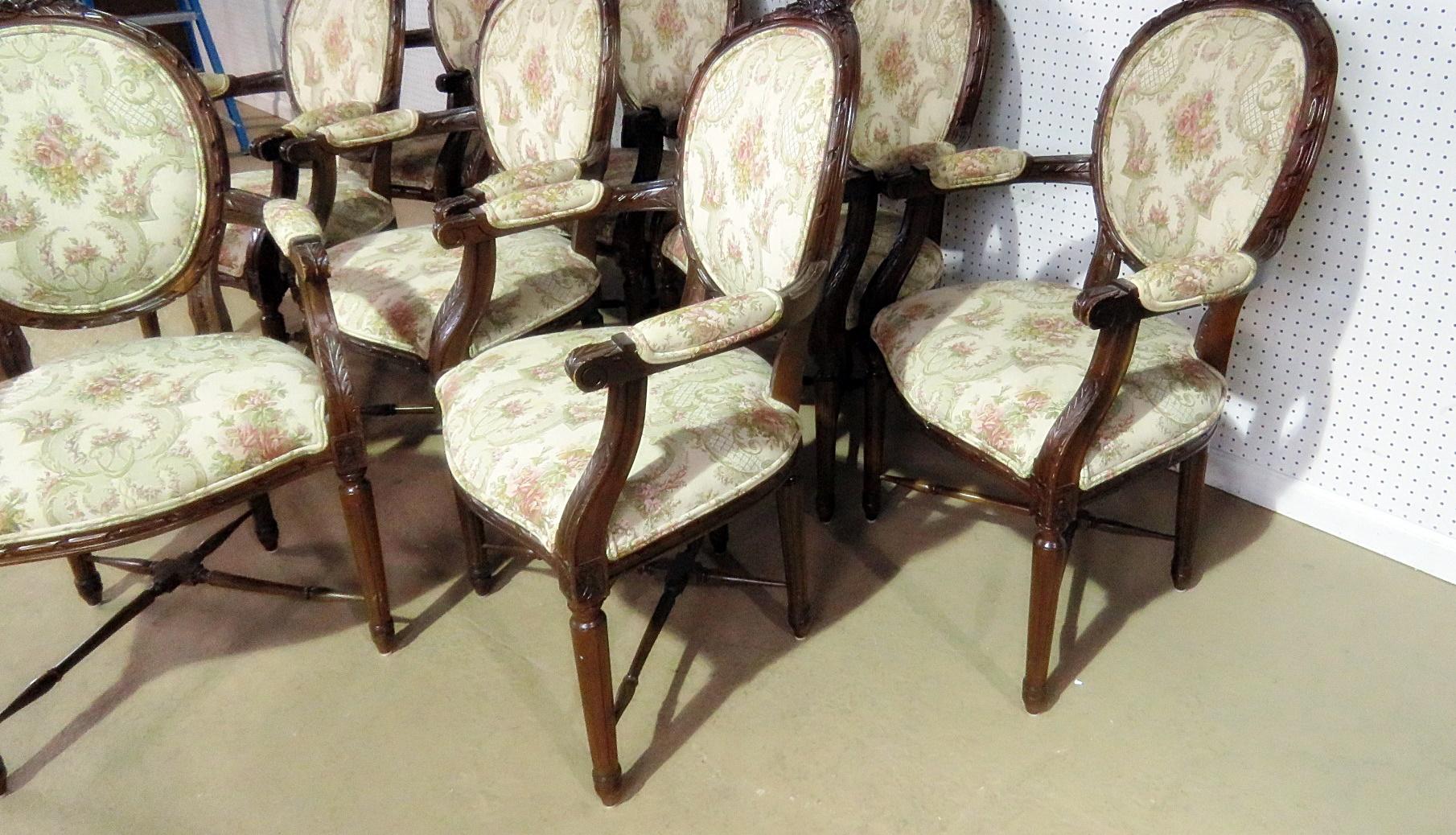 Set of eight Louis XVI style upholstered dining armchairs.