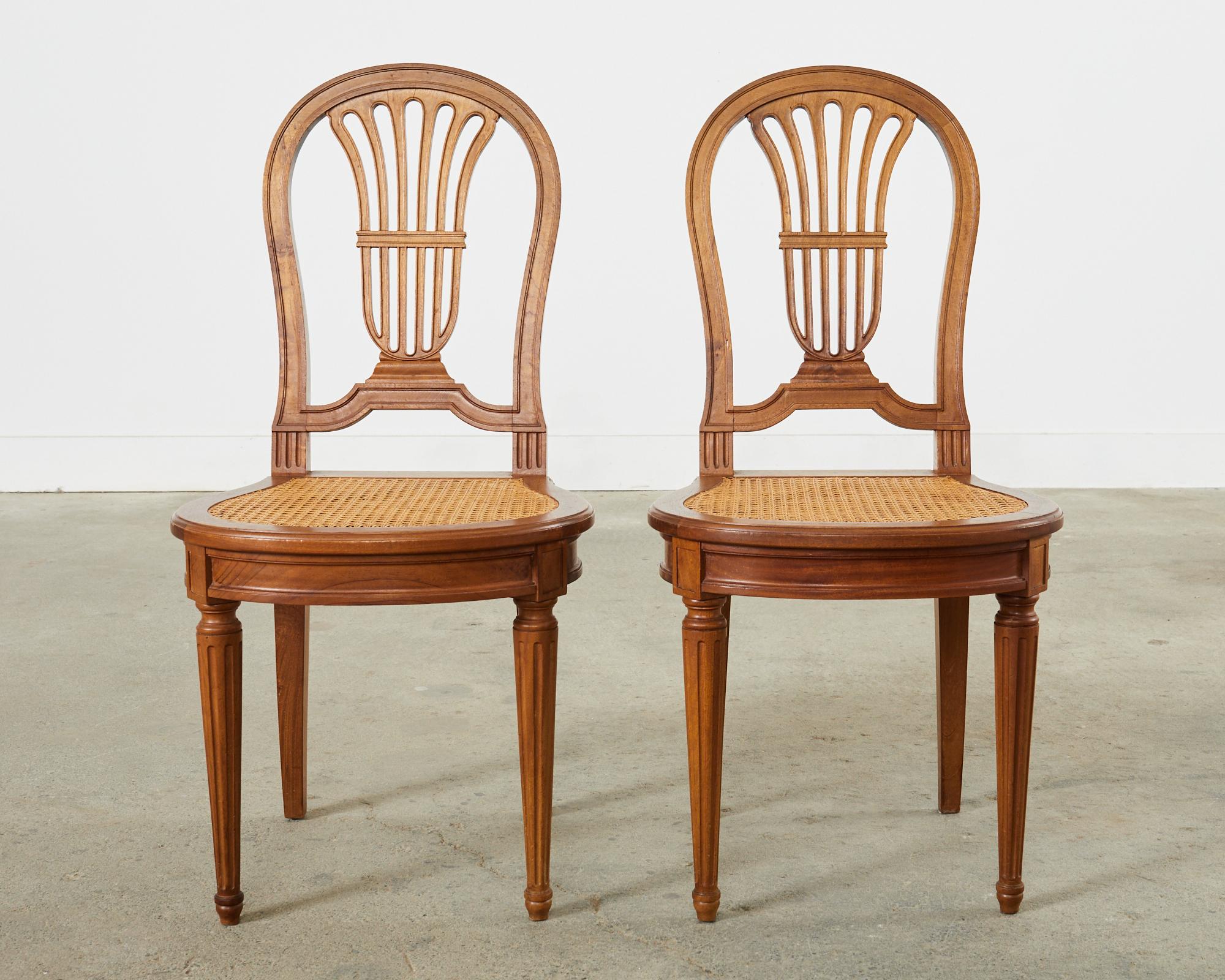 Hand-Crafted Set of Eight Louis XVI Style Walnut Cane Dining Chairs For Sale