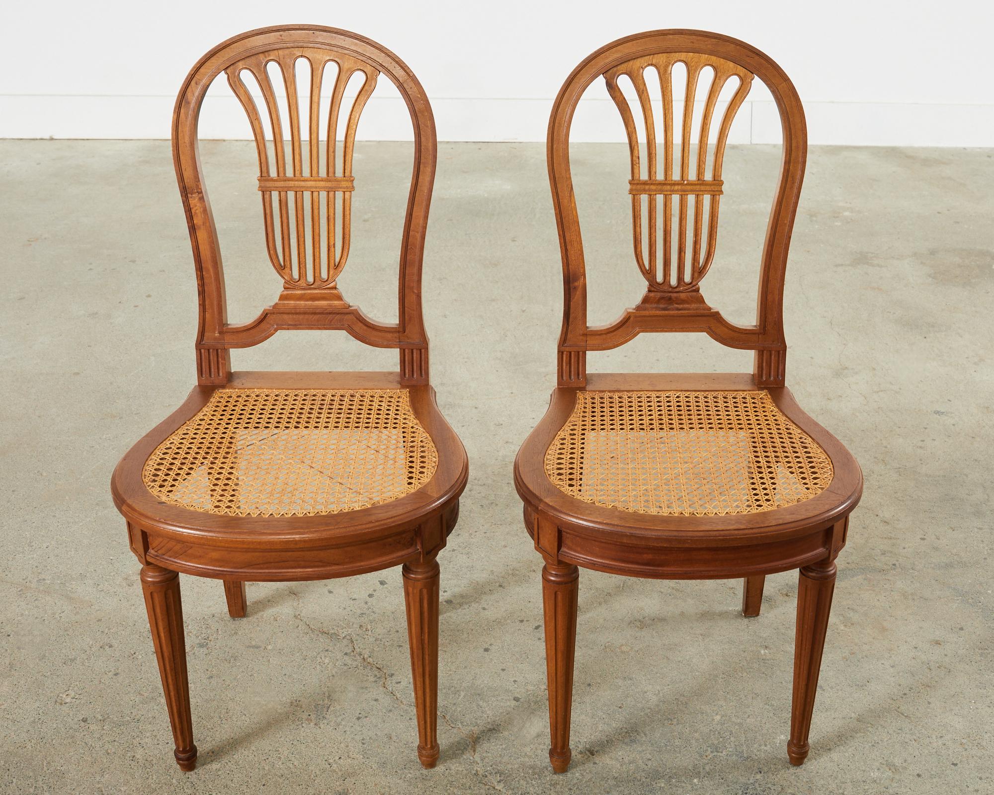 Set of Eight Louis XVI Style Walnut Cane Dining Chairs In Good Condition For Sale In Rio Vista, CA