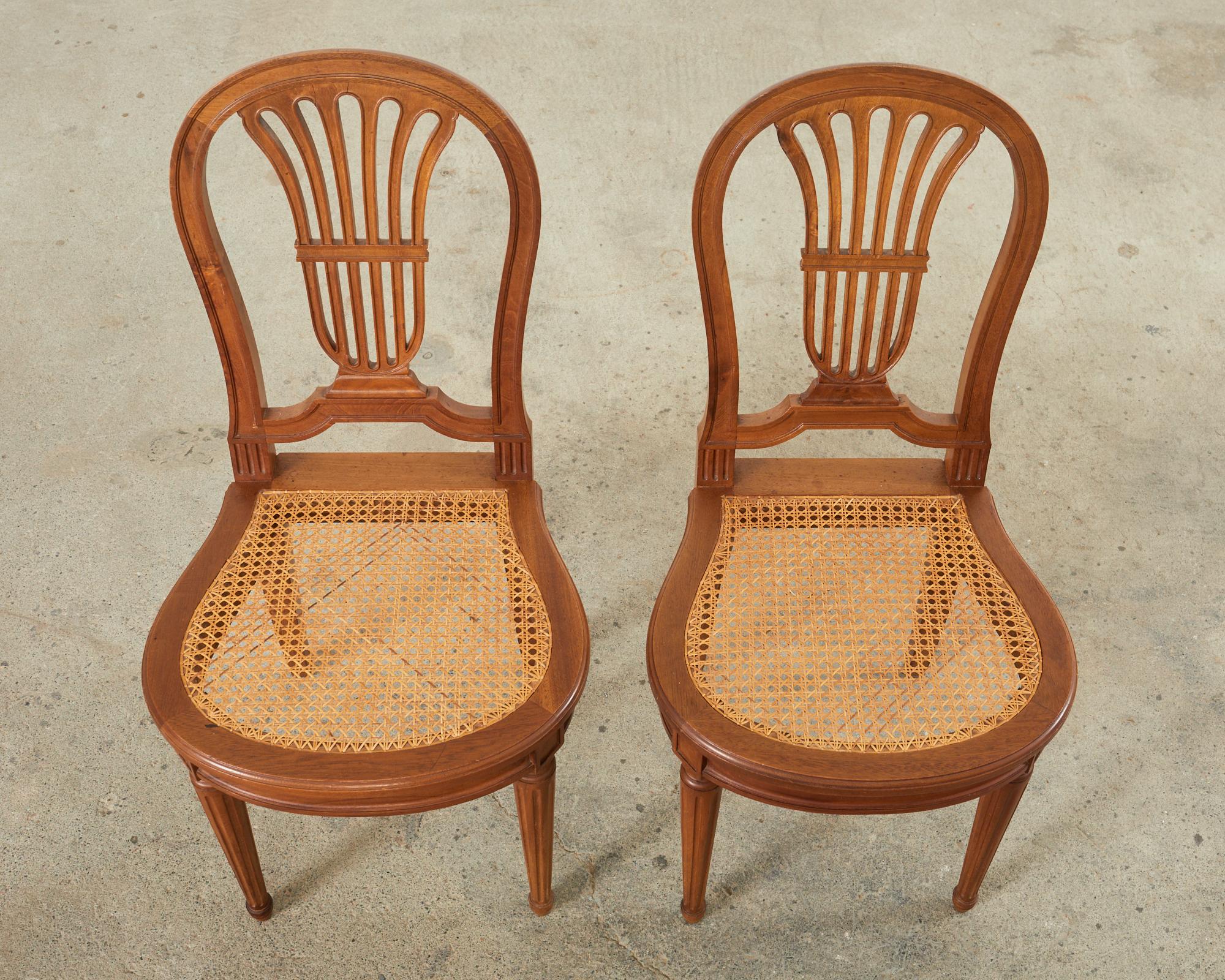 19th Century Set of Eight Louis XVI Style Walnut Cane Dining Chairs For Sale