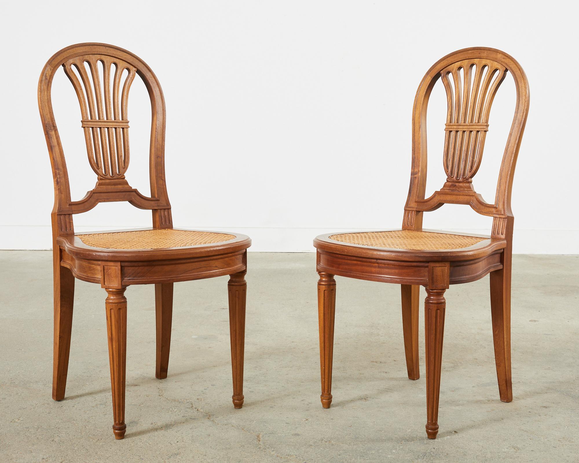Set of Eight Louis XVI Style Walnut Cane Dining Chairs For Sale 1