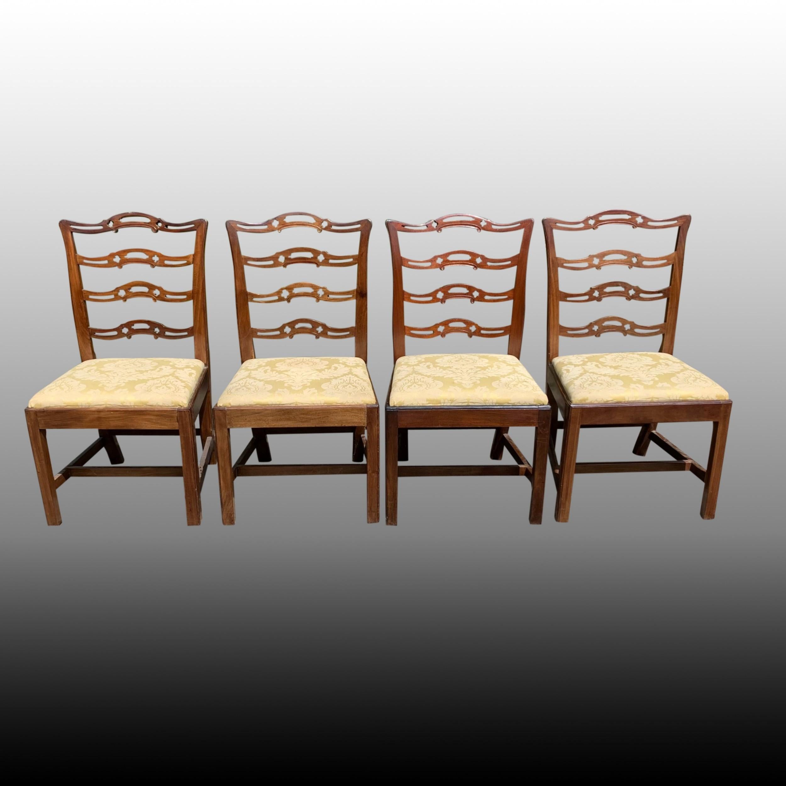 A good set of eight mid 19th century Chippendale style mahogany ladder-back dining chairs in good original condition. The finely carved and pierced back rails above drop-in seats and standing on square chamferred legs with 'H' stretchers.
A