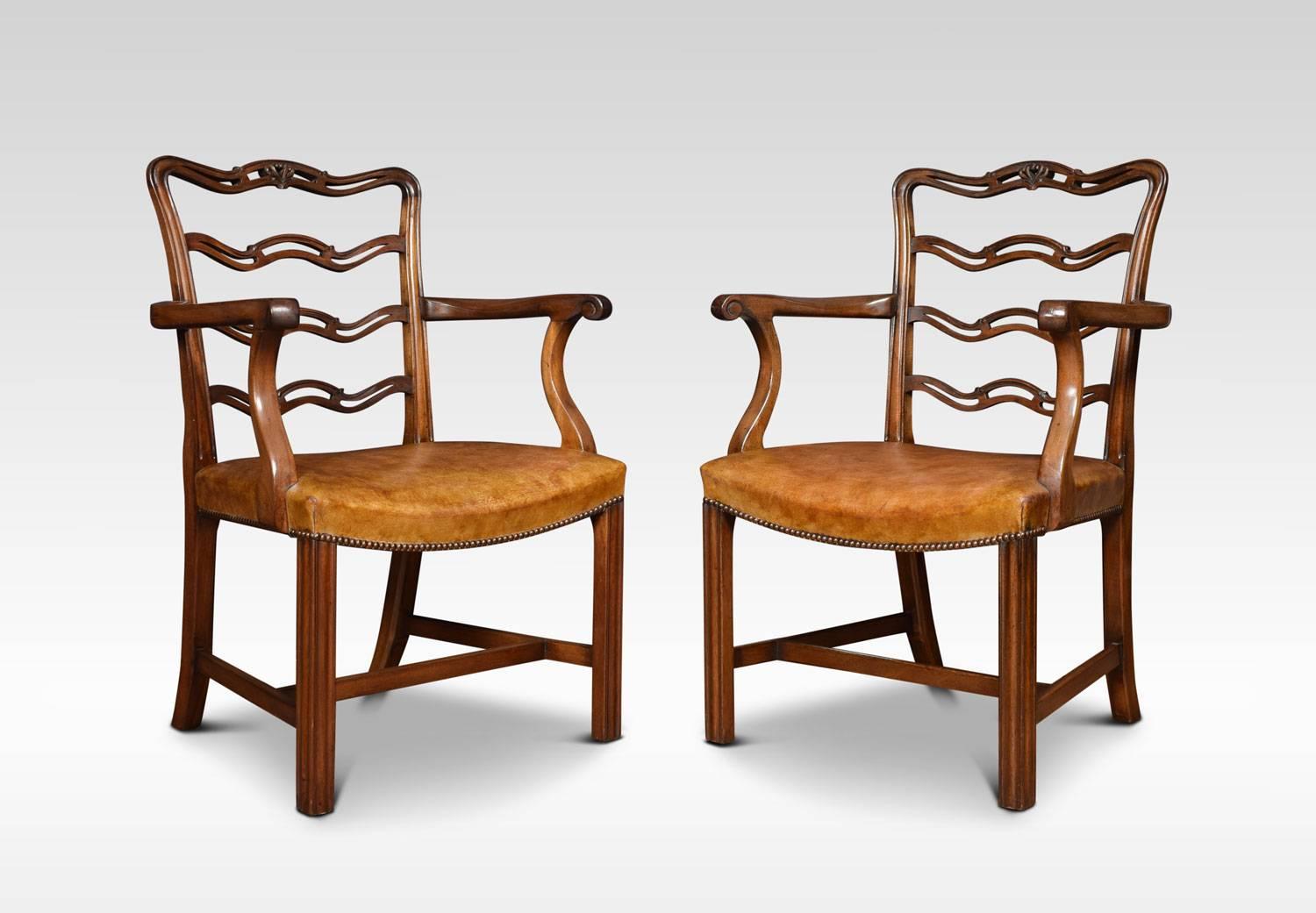 Set of eight Chippendale style dining chairs. comprising of six side chairs and two Arm Chairs.The shaped ribbon backs with broad concave leather upholstered seats. All raised up on square legs united by H stretcher.
Dimensions
Arm Chairs
Height