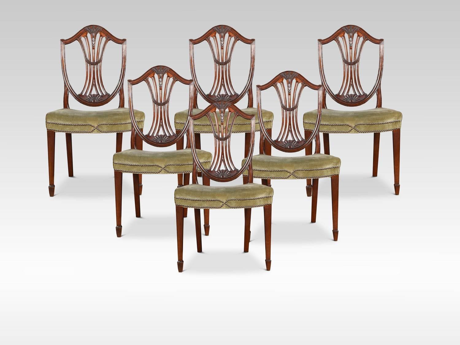 A set of eight very good quality mahogany Hepplewhite style dining chairs consisting of two carver armchairs, and six side chairs, all having pierced wheatsheaf carved splats above green upholstered overstuffed seats. All raised up on square