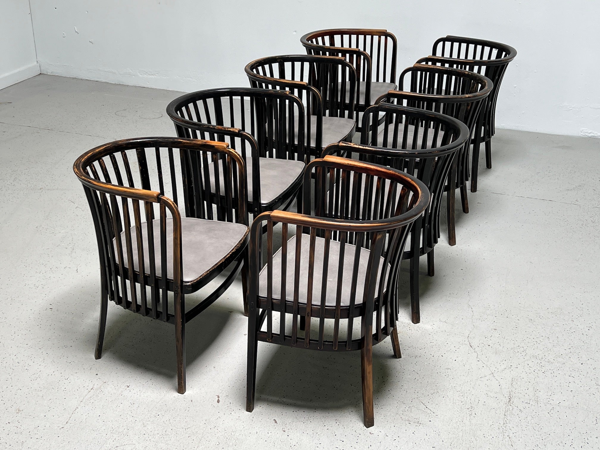 A set of eight beautifully patinated armchairs designed by Marcel Kammerer for Gebruder Thonet circa 1910. 