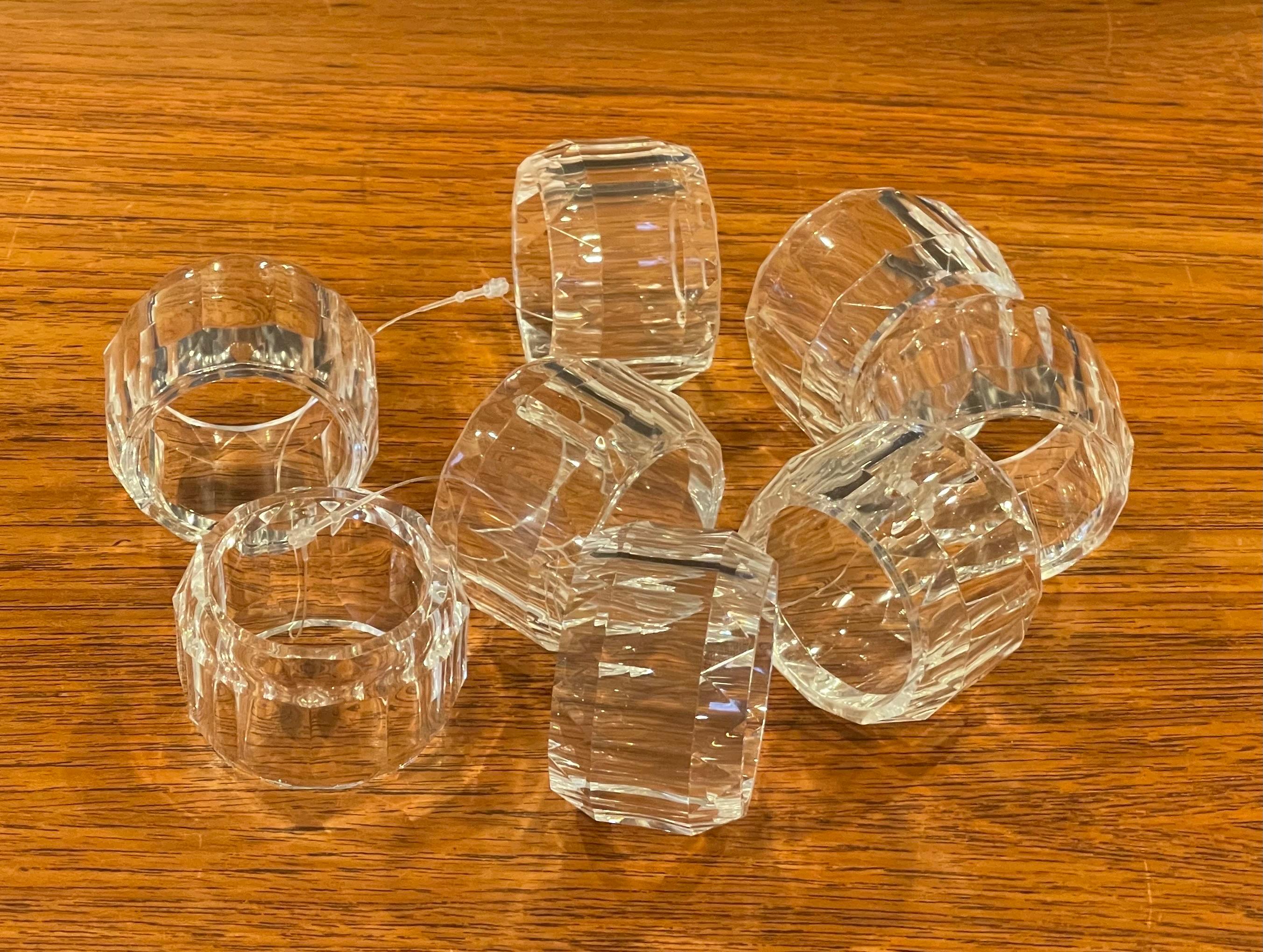 Set of eight MCM lucite napkin rings, circa 1980s. The rings have a circular design and measure 2.25