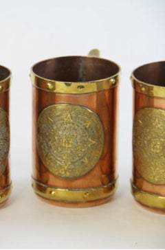 Set of Eight Mexican Copper and Brass Mugs