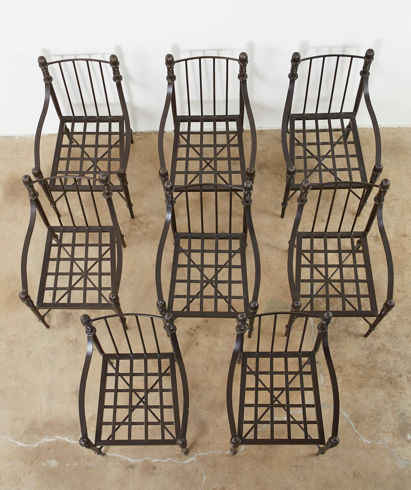 Stately set of eight bronzed solid aluminum garden dining chairs by Michael Taylor. From the Montecito line of California Style designs. These rare chairs are decorated with acanthus motifs and ball finials in the neoclassical style. Heavy and