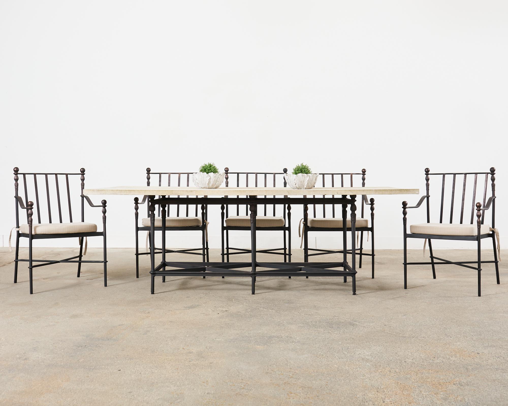 Rare set of eight Montecito cast aluminum patio and garden dining armchairs designed by Michael Taylor. The set consists of all armchairs (Model #MTD-1078) with a matte finish having subtle bronze accents. The iconic chairs have smooth ball finials