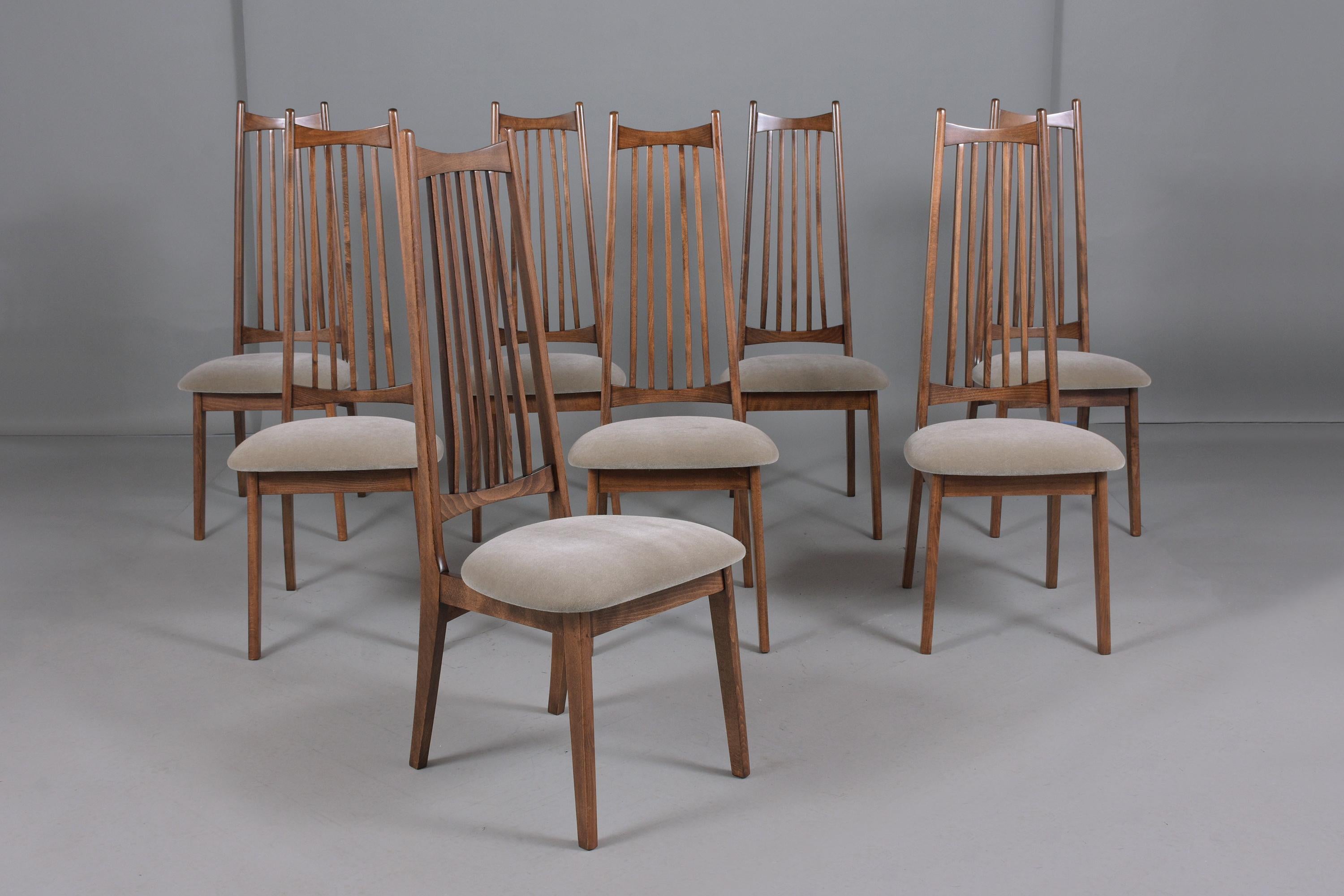 An excellent modern set of eight dining chairs attributed to Adrian Pearsall are hand-crafted out of solid wood professionally restored and newly refinished/upholstered by our craftsmen in the house. These fabulous dining chairs are newly stained in