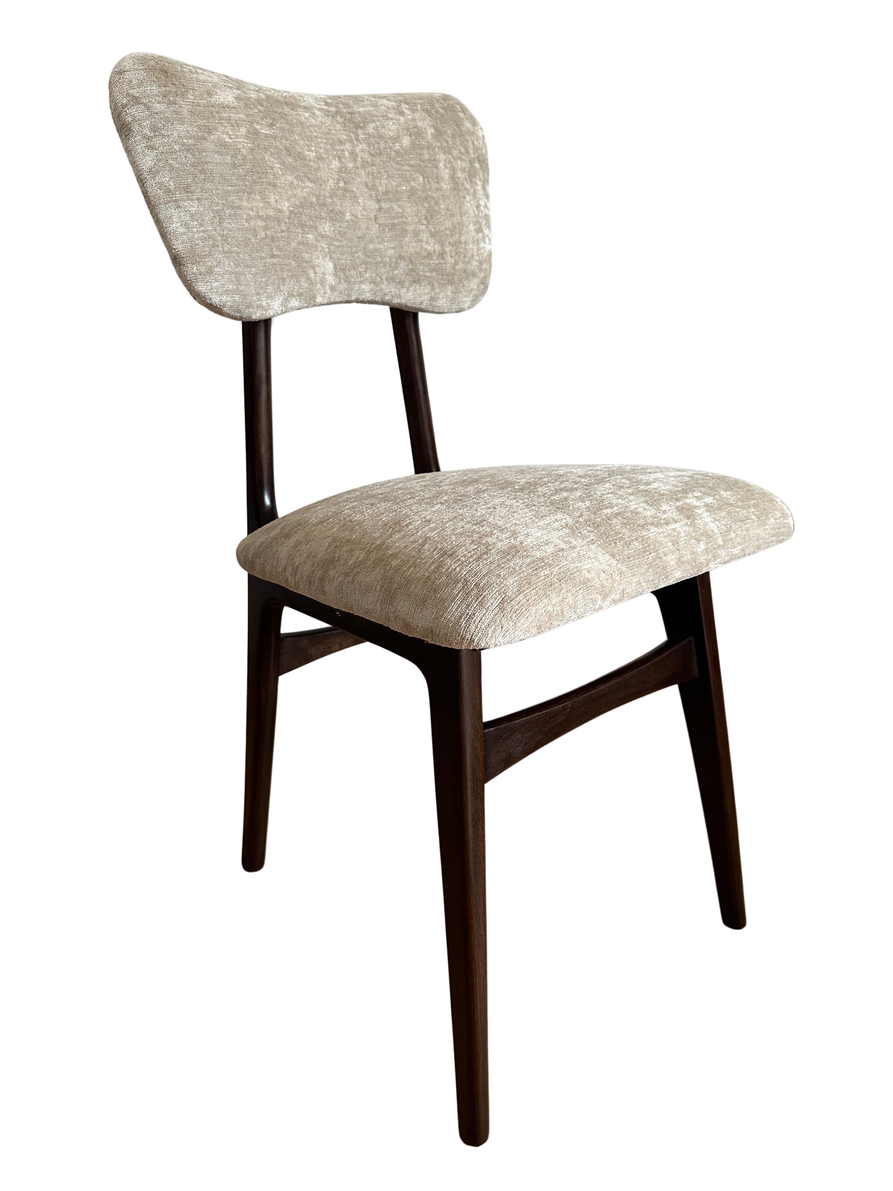 Unique set of eight chairs manufactured in Poland in the 1960s, designed by Rajmund Halas. 

The upholstery is made of velvet fabric in warm beige color. reflecting the colors of nature. It's a soft, fine, woven upholstery velvet. The fabric has