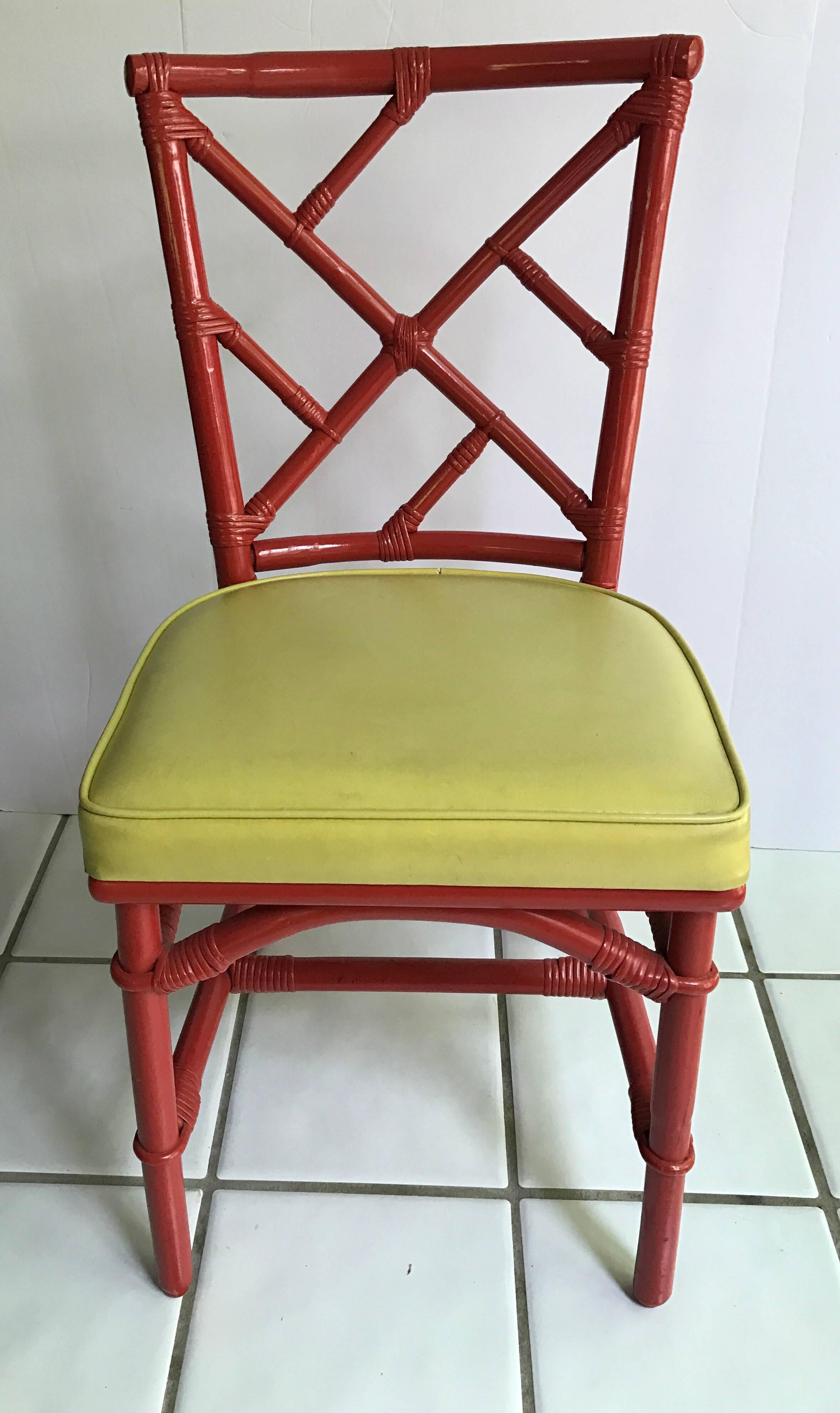 Exceptional set of eight bamboo Chinese Chippendale red chairs. Client purchased in 1970s from DIA.
No hallmarks. Seat covers are vinyl and some have slight tearing at seams. There are two armchairs and six matching side chairs.
    