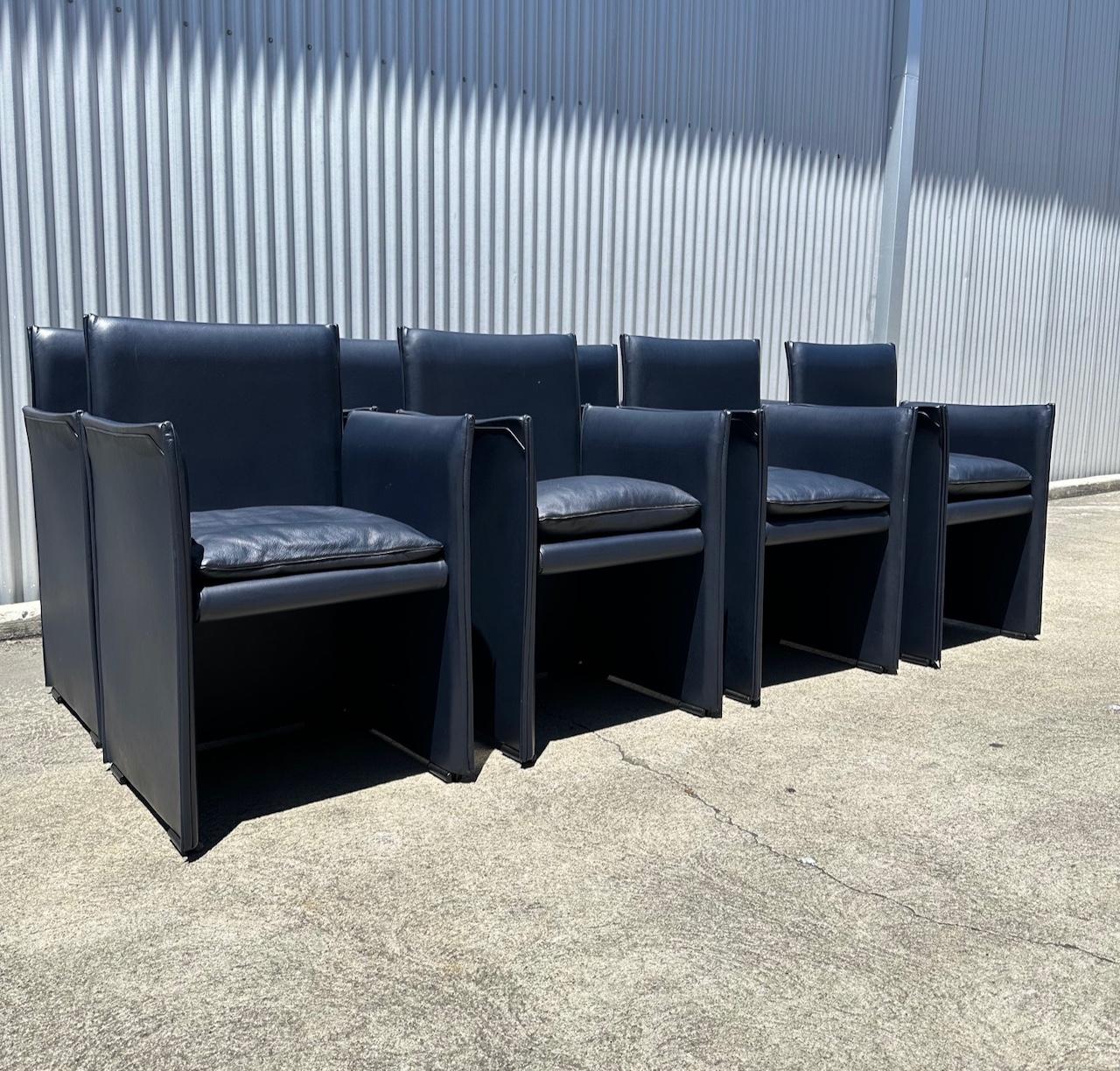 Outstanding set of Eight Midnight Blue leather Break Chairs by Mario Bellini for Cassina- Italy. The chairs present as though they've never been used and the color of the leather is as good as it gets. The chairs are eminently comfortable and are