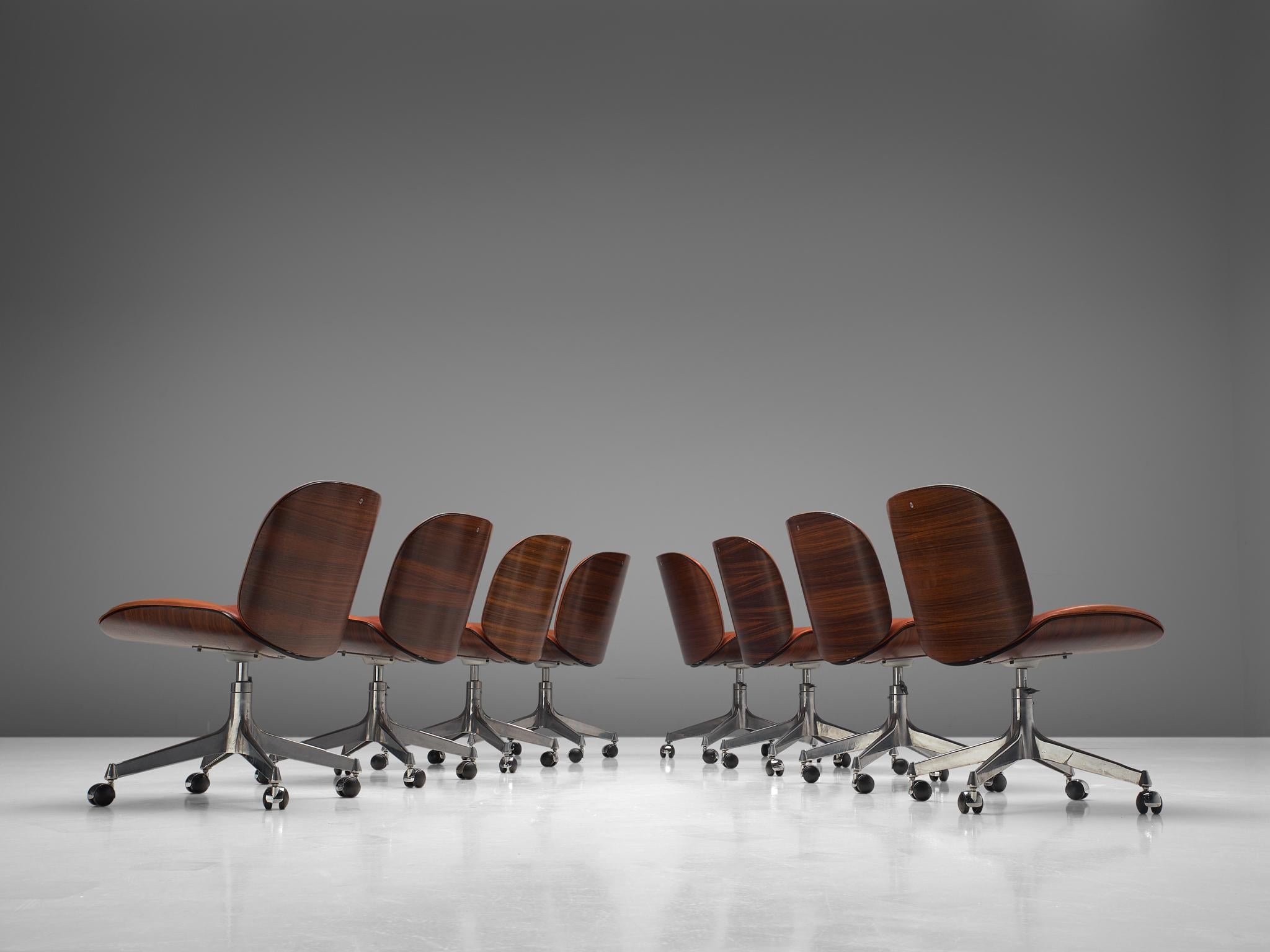 Ico Parisi for MIM Roma, set of 8 office chairs, rosewood, metal and leather, Italy, 1950s.

Set of eight swivel office chairs from the 'Terni' series by MIM Roma. The seating and back consist of curved shells made of rosewood, which hold the