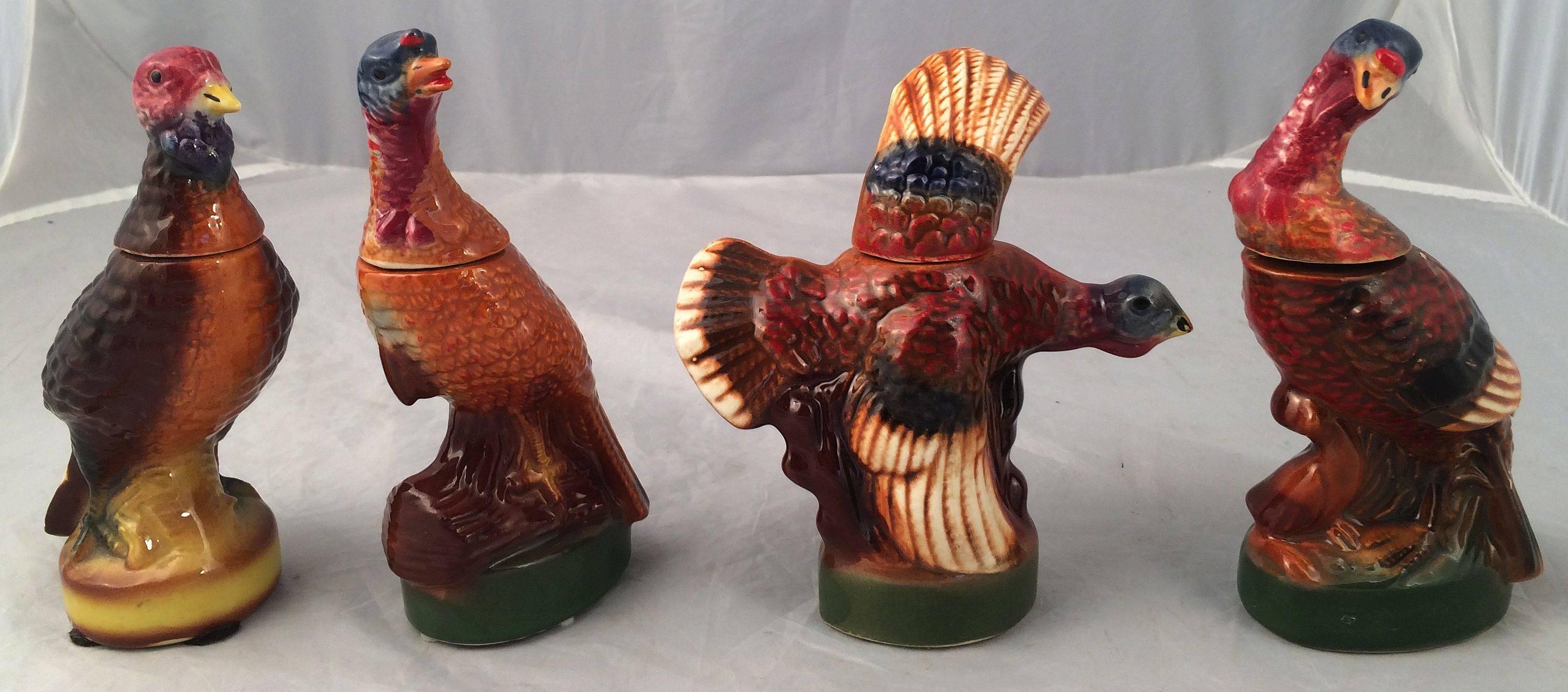 A set of eight vintage mini Wild Turkey decanters featuring the popular and hard-to-find #3 flying and #8 fan-tail decanters.

Each mini marked on base with design number.

Ceramic creation collectible liquor bottles made for Austin Nichols Wild