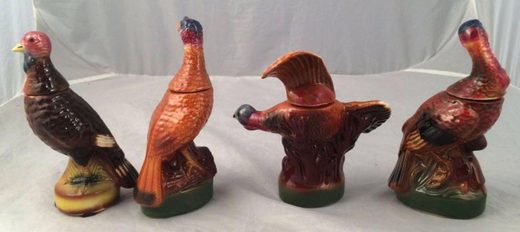 A set of eight vintage mini wild Turkey decanters featuring the popular and hard-to-find #3 flying and #8 fan-tail decanters.

Each mini marked on base with design number.

Ceramic creation collectible liquor bottles made for Austin Nichols Wild