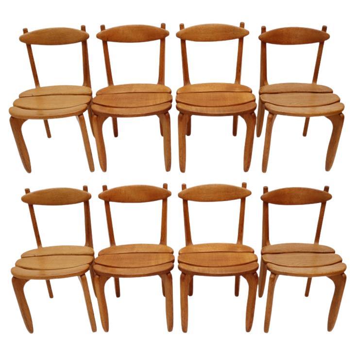 Set of eight mid-century modern solid oak dining room chairs
by Guillerme et Chambron
Edition Votre Maison
Model Thierry, France circa 1970
Oak shows a nice overall patina.
Minimalist yet comfortable
20 chairs available if larger set