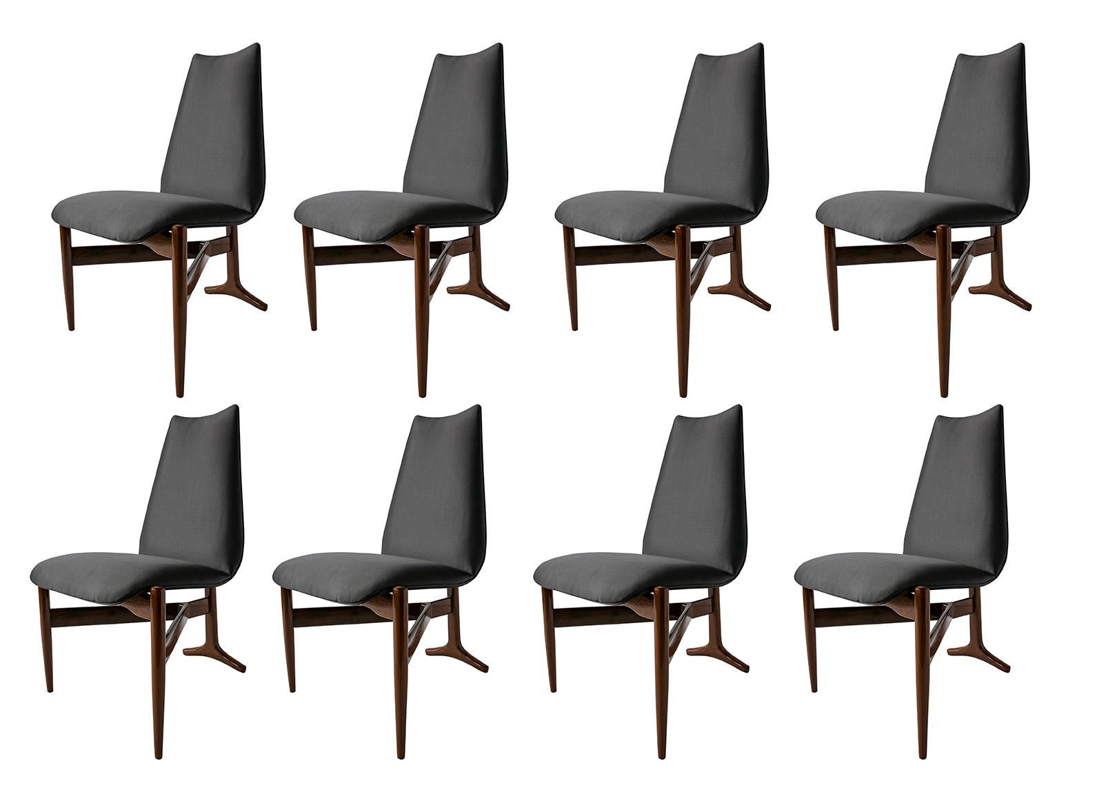 A unique set of 14 (Fourteen) Italian Modern chairs by Giuseppe Scapinelli. 3 legged chairs that are triangular in shape. The seat and back are upholstered and appear to be floating, over a Y-shaped wooden base. The rear leg, which extends along the