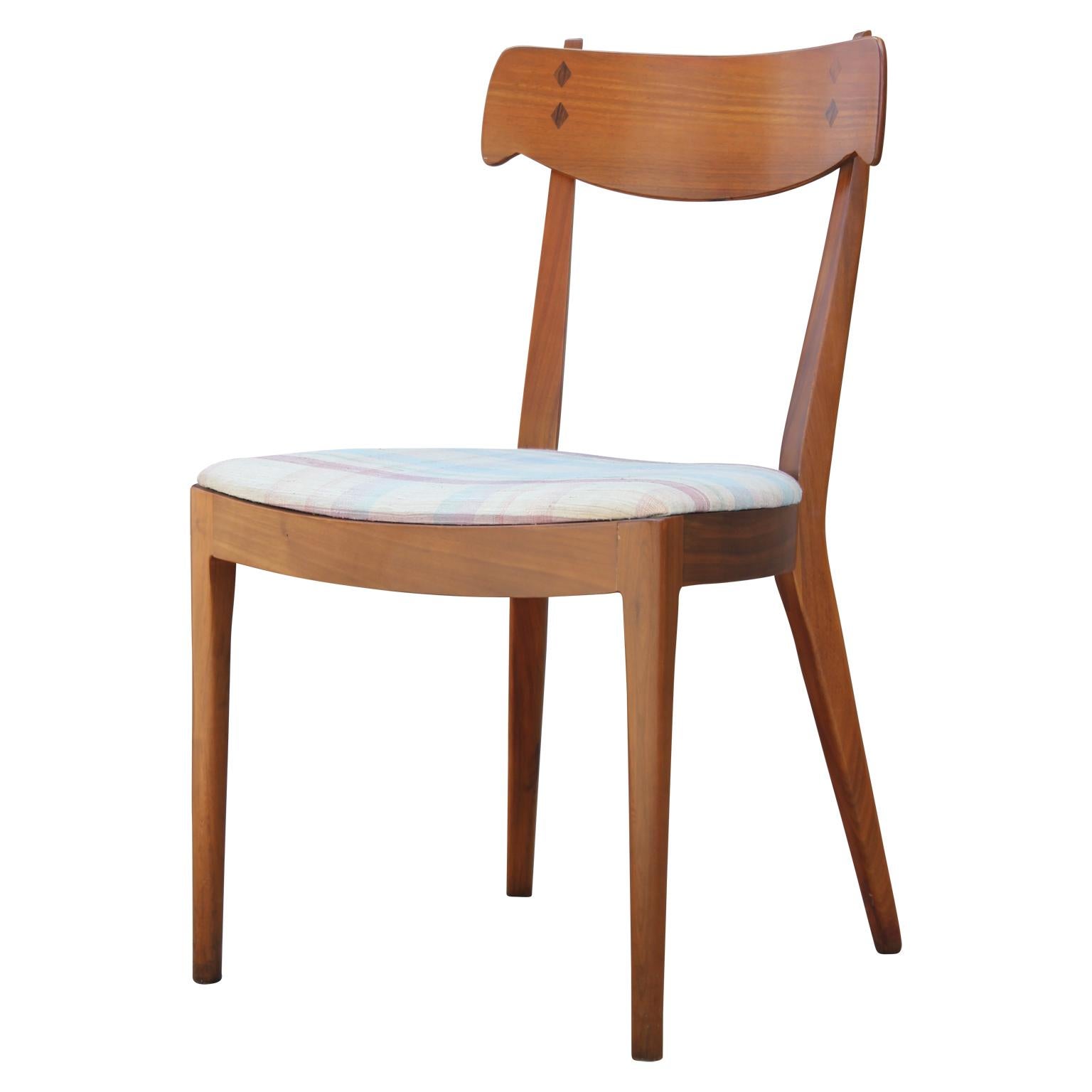 Wonderful Mid-Century Modern set of eight Danish style dining chairs designed by Stewart MacDougall and Kipp Stewart for Drexel's Declaration line. Made from gorgeous walnut with rosewood inlays. Features six armless chairs and two end chairs with