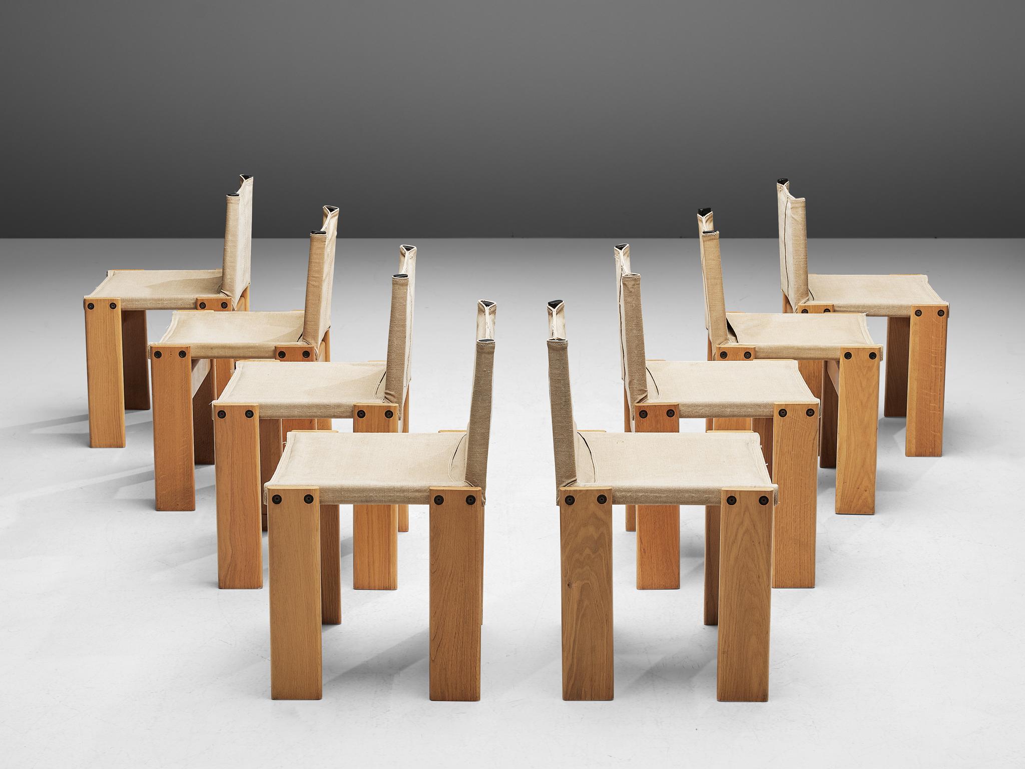 Afra & Tobia Scarpa for Molteni, set of eight 'Monk' chairs, oak and beige canvas, Italy, 1974.

The natural canvas forms a well-balanced combination with the oakwood. Interesting is the 'flat' shape of this chair where the designer has chosen to