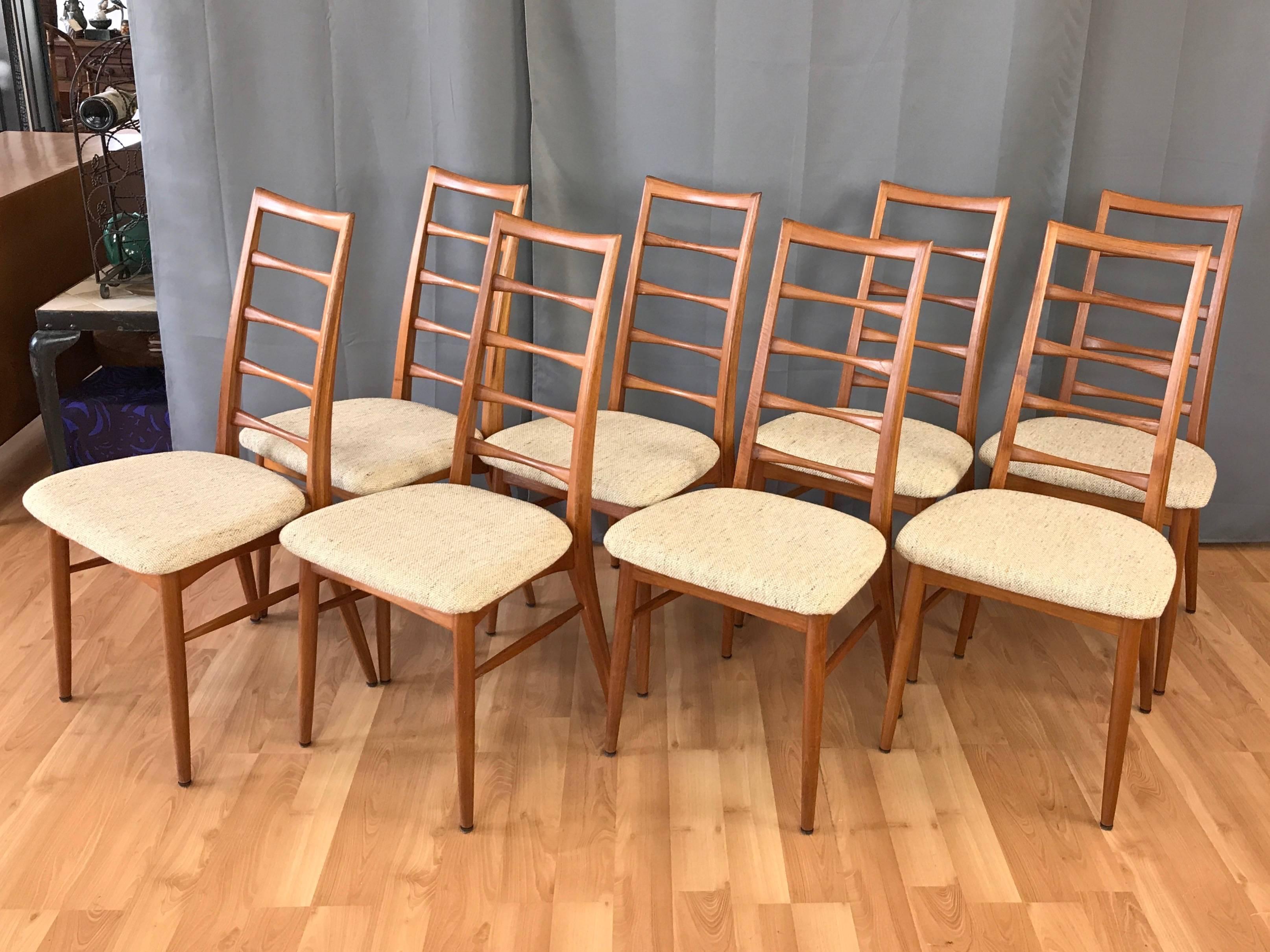 A set of eight Danish “Lis” ladder back teak dining chairs by Niels Kofoed for Koefoeds Hornslet.

Sculptural solid teak frame defined by a gracefully arced bentwood back with bone-shaped slats, their classic mid-century modern lines being echoed
