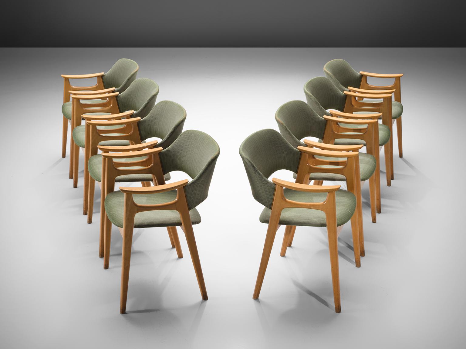 Set of eight chairs, in beech and green fabric, Norway, 1960s.

These Norwegian elegant dining chairs show elegant lines and stunning wood connections. The visually almost floating seat with the well sized back, provide great comfort. The natural