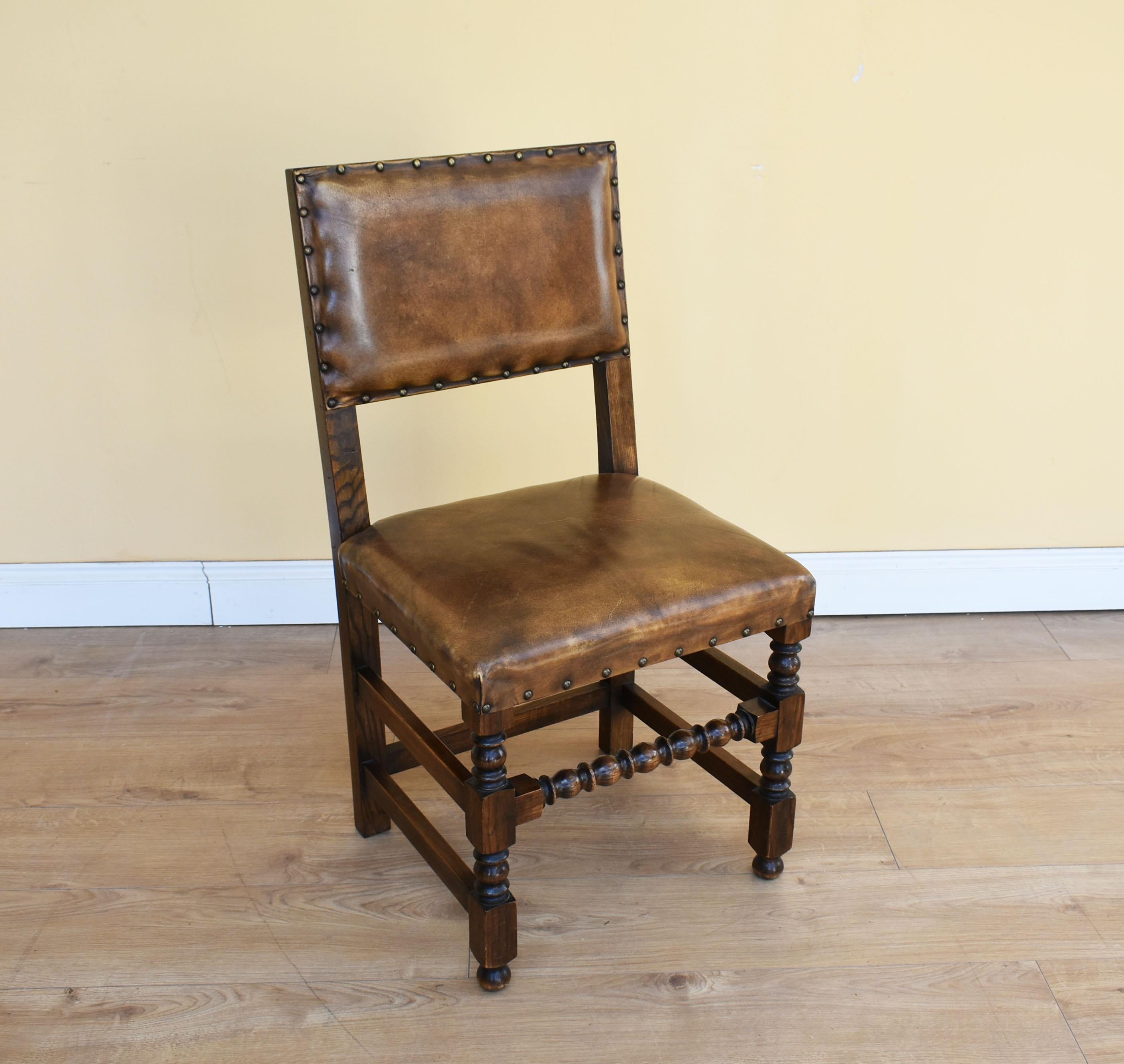For sale is a good quality set of eight Cromwellian style leather upholstered dining chairs by Bevan and Funnel. Each having stud closed upholstered square backs and seats, on turned and block under structure. All of the chairs are in good order,