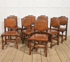 Set of Eight Oak Dining Chairs with Leather Upholstery