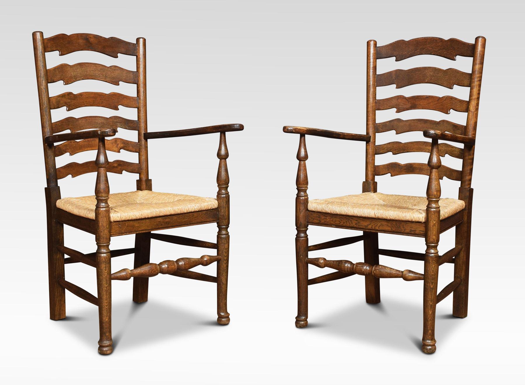 A set of eight wavy ladder back oak dining chairs comprising of two armchairs and six chairs, The wavy ladder backs with rush seats on turned front legs united by stretchers.
Dimensions:
Armchairs
Height 41 inches height to seat 19 inches
Width 20