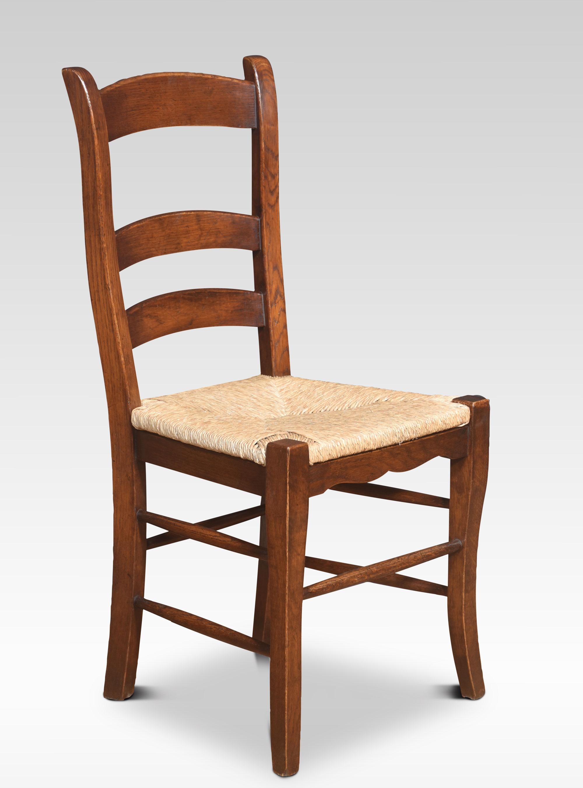 British Set of eight oak ladder back dining chairs