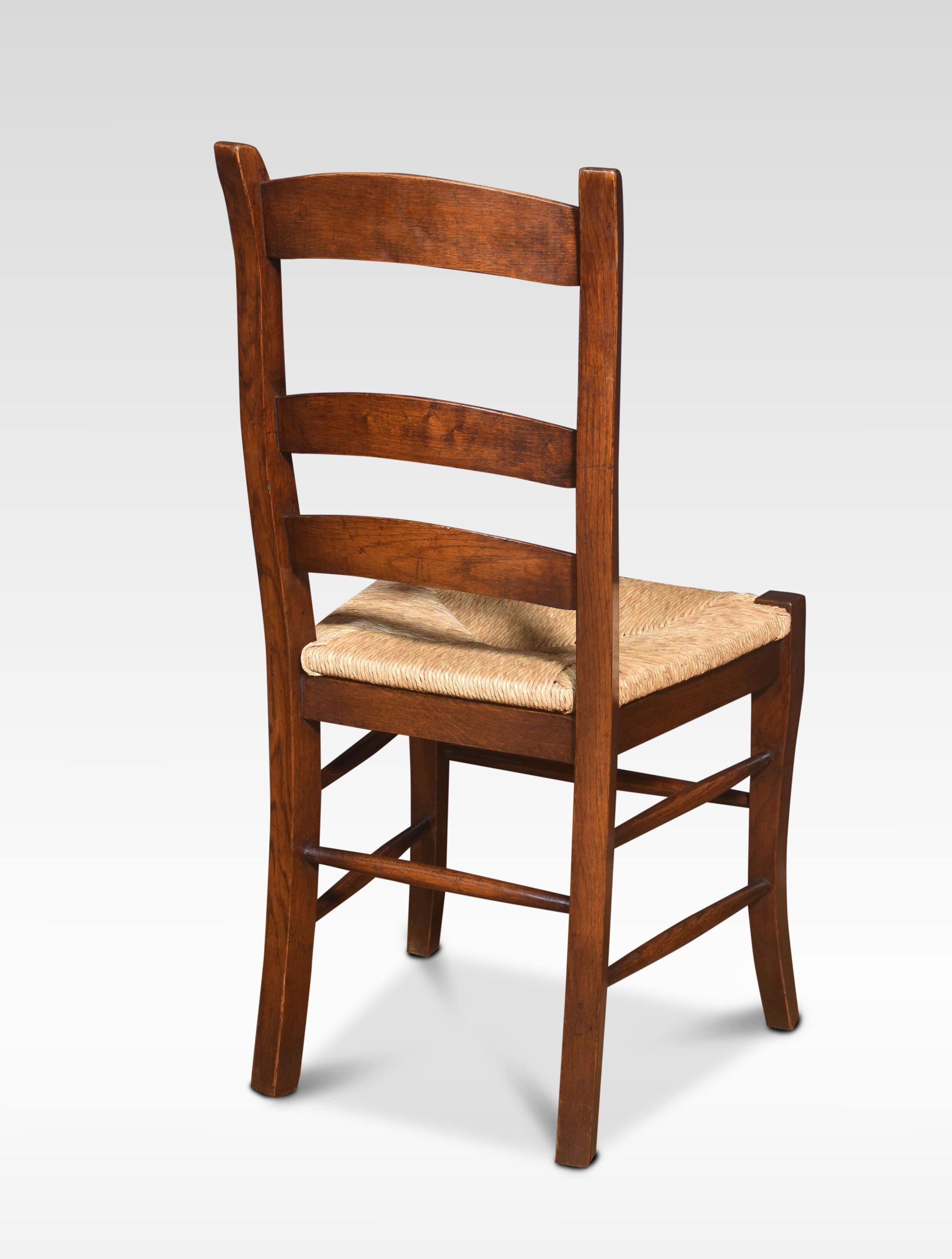 Set of eight oak ladder back dining chairs 1