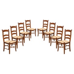 Set of eight oak ladder back dining chairs