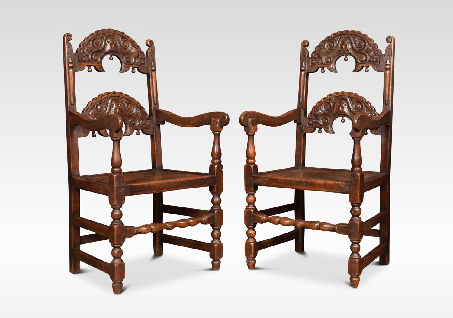 Comprising off a set of six chairs and two similar armchairs. Having arched supports with acorn drop finials above solid oak seats. All raised up on turned supports united by stretchers.
Dimensions:
Armchairs
Height 45 inches height to seat 18